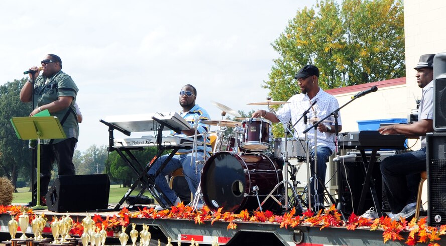 BARKSDALE AIR FORCE BASE, La. -- The band Front Cover featuring Mark Scroggins performs for Airmen and their families at the fall festival held outside the Stripes Club Oct. 23. The fall festival featured games, sponsor booths, food and fun for Airmen and their families. (U.S. Air Force photo/Senior Airman Joanna M. Kresge)
