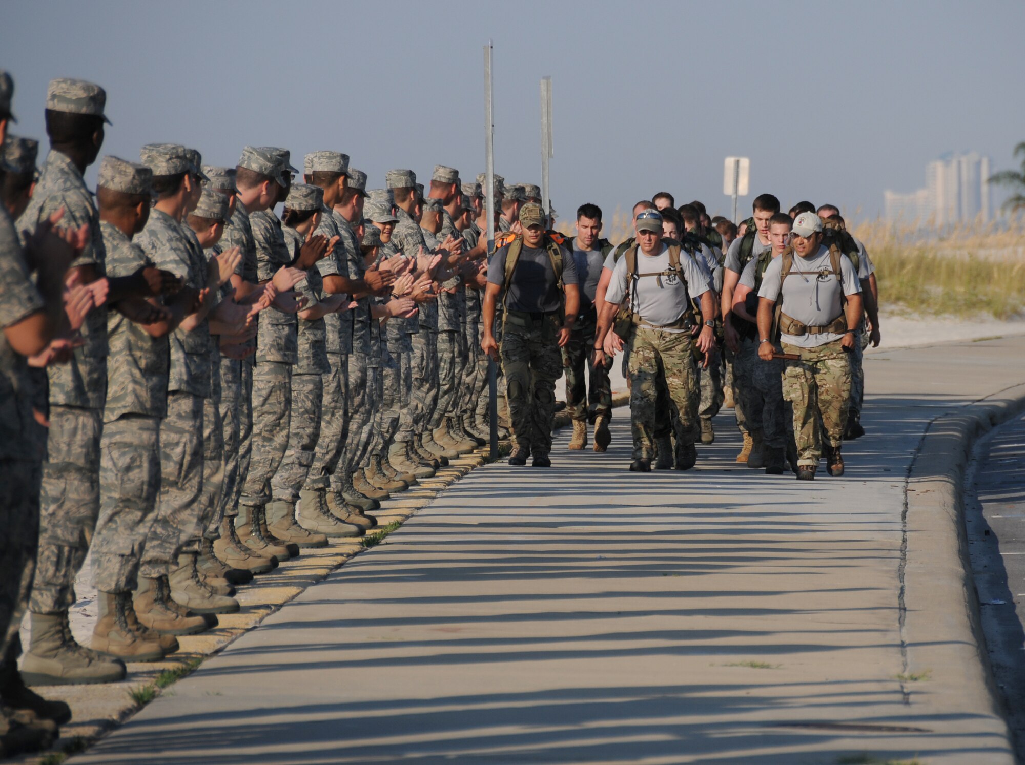 From left, Staff Sgt. Robert Parra and Lt. Col. Patrick Barnett, 342nd Training squadron, Lackland, join Staff Sgt. Robert Gutierrez, 21st Special Tactics Squadron, Pope AFB, N.C., in leading the Tim Davis Special Tactics Memorial March down
Highway 90. Colonel Barnett is the 342nd TRS commander. Combat control trainees and instructors from Keesler joined them in honoring their fallen comrades. Students from the 81st Training Group lined the route at White Avenue intersection to cheer the procession on.  (U.S. Air Force photo by Kemberly Groue)