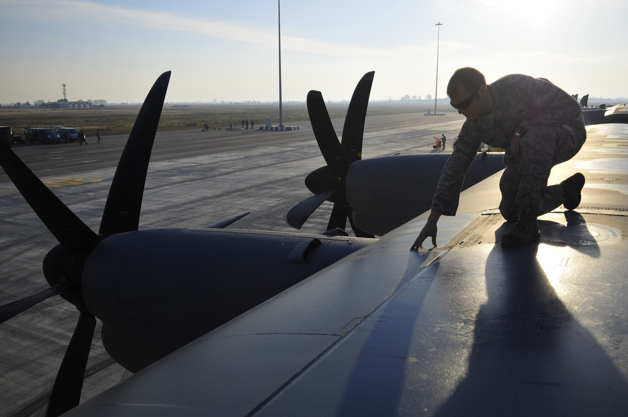 U.S. Air Force Senior Airman Shaun Moody, 86th Aircraft Maintenance Squadron crew chief performs a dropped object prevention program inspection on a C-130J Super Hercules prior to taking off at Thracian Fall 2010, Oct. 25, at the Plovdiv, Bulgaria airport. Thracian Fall 2010 is a two week on-site training deployment designed to build partnership between the U.S. and Bulgarian Air Force. During Thracian Fall U.S. paratroopers were able to assist 1077 Bulgarian Airmen receive valuable jump training. (U.S. Air Force photo by Tech. Sgt. Michael Voss)