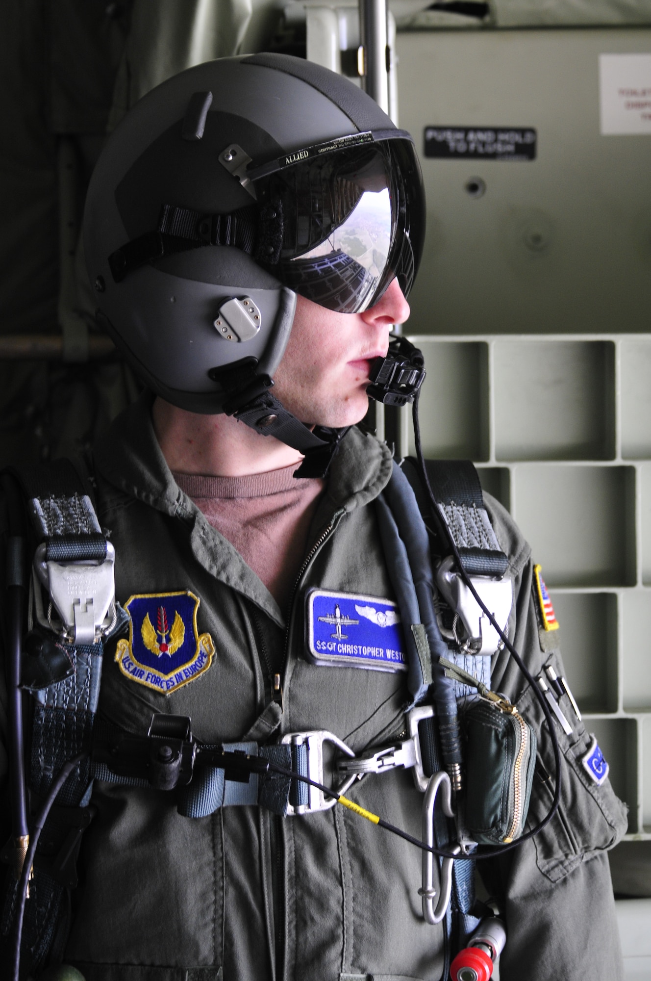 U.S. Air Force Staff Sgt. Christopher Weston, 37th Airlift Squadron loadmaster, takes in the terrain of Plovdiv, Bulgaria, as seen from the rear of a C-130J Super Hercules flying 11,000 feet above sea-level. Sergeant Weston is deployed to Bulgaria to support Thracian Fall 2010, a two week on-site training deployment designed to build partnership between the U.S. and Bulgarian Air Force. During Thracian Fall U.S. paratroopers were able to assist 1077 Bulgarian Airmen receive valuable jump training. (U.S. Air Force photo by Tech. Sgt. Michael Voss)