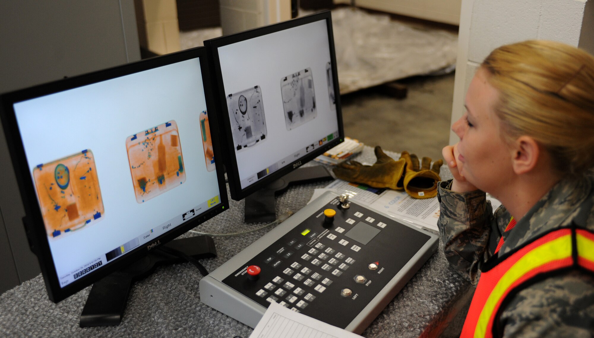 SEYMOUR JOHNSON AIR FORCE BASE, N.C. -- Airman Christy Mote keeps a keen eye as she scans mobility bags for unwarranted items during the operational readiness inspection here, Oct. 26, 2010. Airman Mote worked on the baggage build-up team which guaranteed that bags met Federal Aviation Administration standards and were palletized correctly. Airman Mote, 4th Communications Squadron knowledge operations manager, is from Charlotte. (U.S. Air Force photo/Senior Airman Makenzie Lang)(RELEASED)