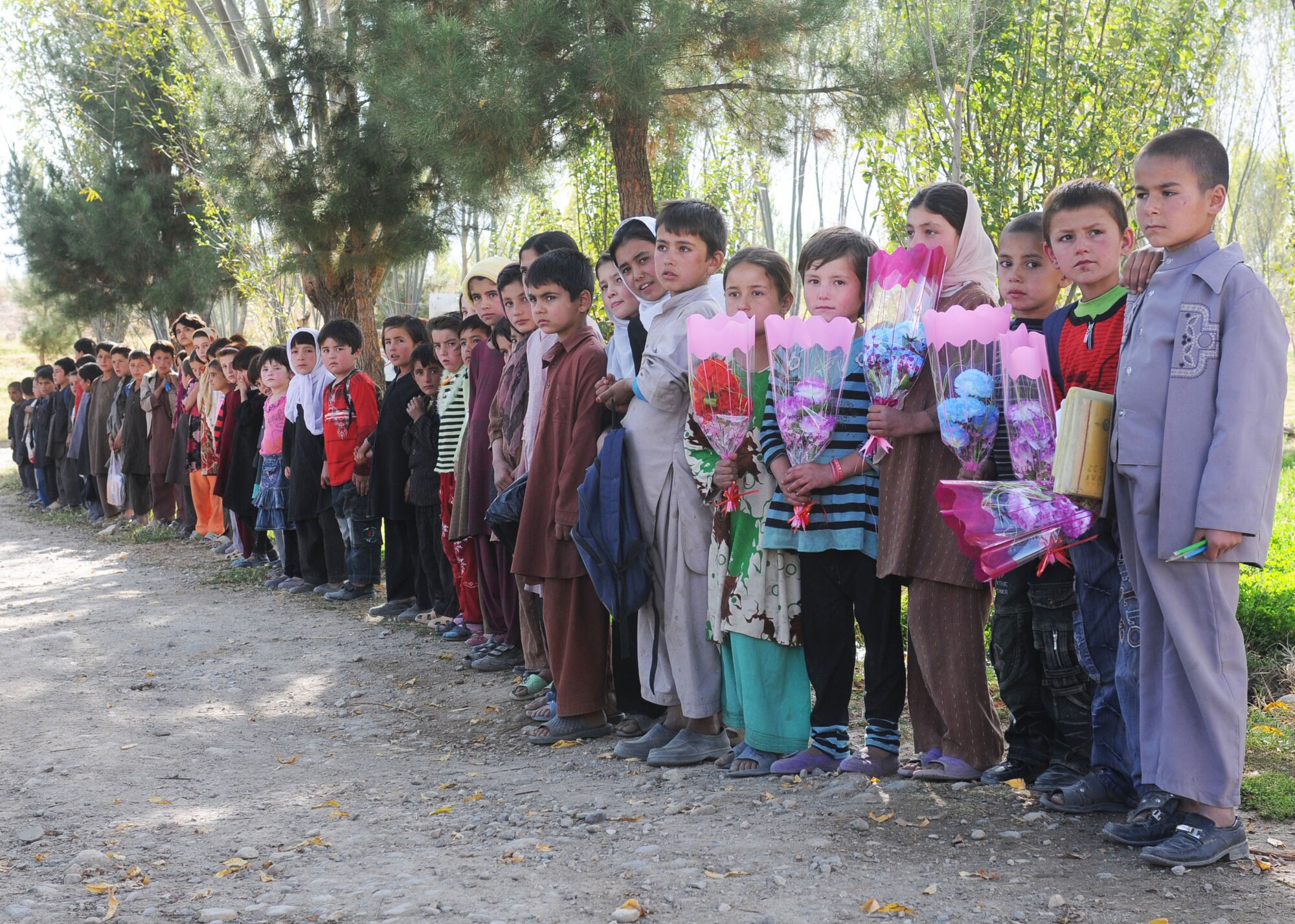 BADAKHSHAN, Afghanistan -- Afghan Air Force and Coalition forces deliver aid to the province of Badakhsan Oct. 26 as part of continued humanitarian assistance to the region. More than 2,000 kilograms of toys, clothes, furniture and school supplies were distributed during the mission. (US Air Force photo by MC2 Vladimir Potapenko/Released). 