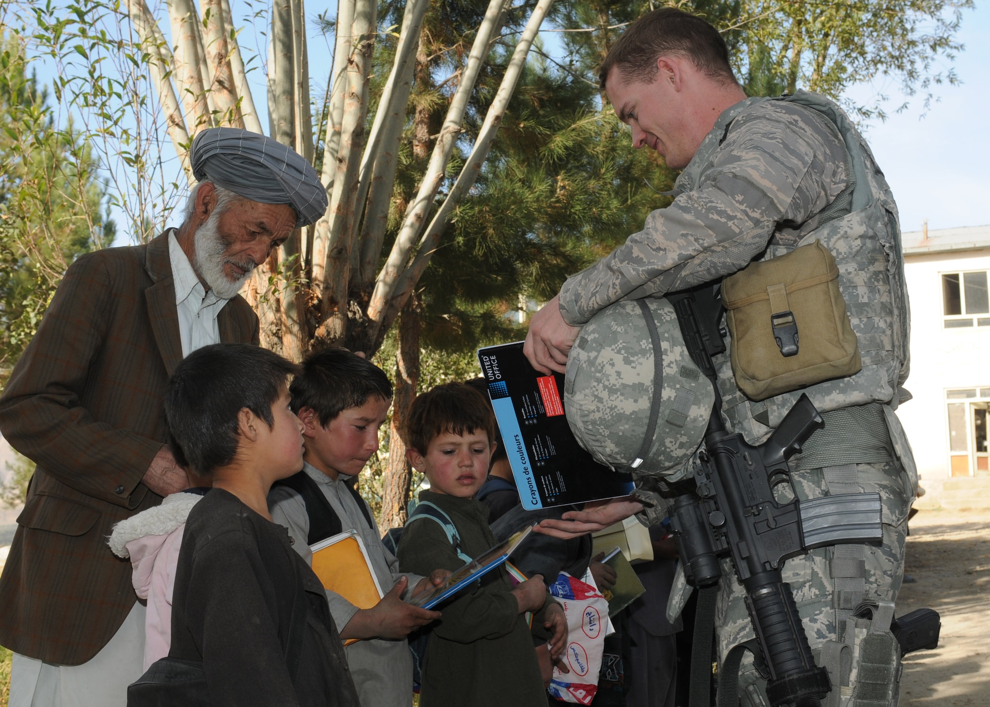 BADAKHSHAN, Afghanistan -- Afghan Air Force and Coalition forces deliver aid to the province of Badakhsan Oct. 26 as part of continued humanitarian assistance to the region. More than 2,000 kilograms of toys, clothes, furniture and school supplies were distributed during the mission. (US Air Force photo by MC2 Vladimir Potapenko/Released). 