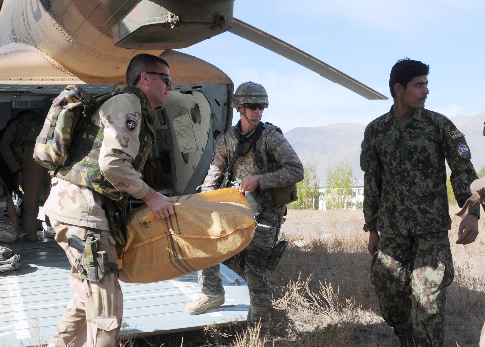 BADAKHSHAN, Afghanistan -- Afghan Air Force and Coalition forces deliver aid to the province of Badakhsan Oct. 26 as part of continued humanitarian assistance to the region. More than 2,000 kilograms of toys, clothes, furniture and school supplies were distributed during the mission. (US Air Force photo by MC2 Vladimir Potapenko/Released). 