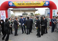 KUNSAN AIR BASE, Republic of Korea -- Col. John Dolan, 8th Fighter Wing commander, shakes hands with Gunsan City officials after the New Horizons ribbon cutting ceremony here Oct. 27, 2010. The event marked the lifting of the fifty-year-old three-mile restriction surrounding Kunsan Air Base. (U.S. Air Force photo/Senior Airman Ciara Wymbs) 