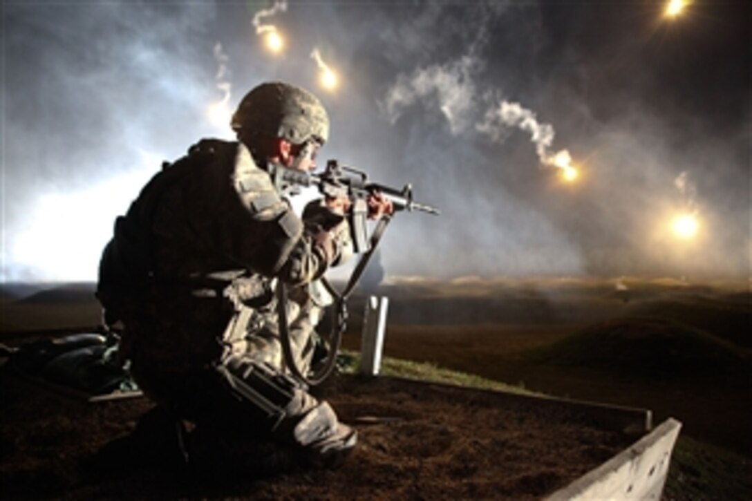 U.S. Army Sgt. Larry J. Isbell, representing the Army National Guard, watches his firing lane for targets at the M-4 Range Qualification event during the Department of the Army's 10th Annual Best Warrior Competition at Fort Lee, Va., on Oct. 21, 2010.  