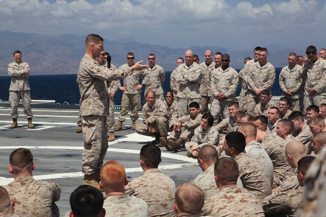Colonel Mark Desens, commanding officer of 26th Marine Expeditionary Unit, talks about the future of the unit and the way ahead to Marines and sailors of Combat Logistics Battalion 26 and Battalion Landing Team 3/8 on the flight deck of USS Ponce, Oct. 29, 2010. Elements of 26th MEU are currently embarked aboard the ships of Kearsarge Amphibious Ready Group and conducting training in the 5th Fleet area of responsibility.