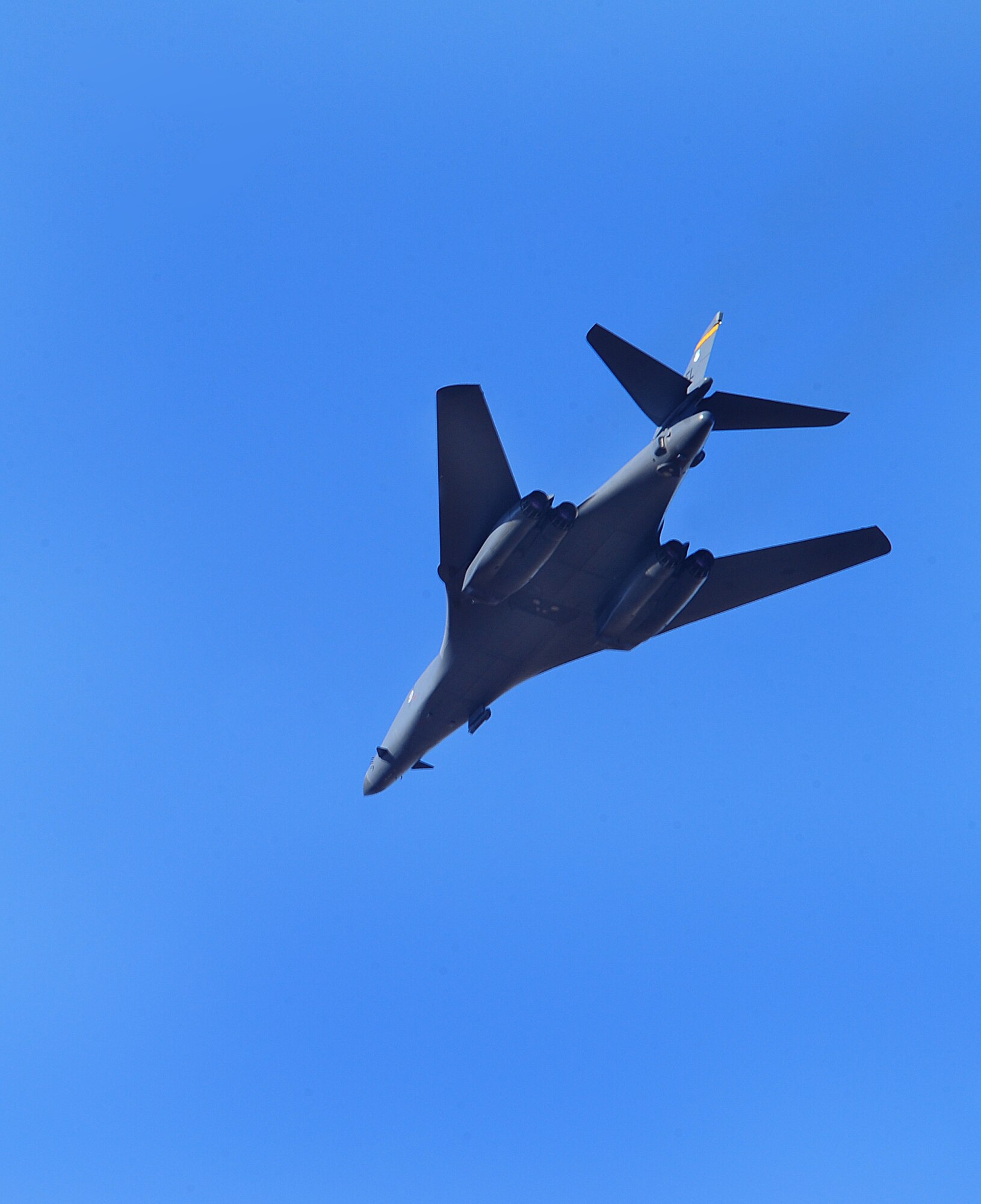 ELLSWORTH AIR FORCE BASE, S.D. -- A B-1B Lancer, with the 37th Bomb Squadron, flies over during a joint-nation training mission with Canadian joint terminal attack controllers in Alzada, MT, Oct. 28.  During the training, the B-1s were equipped with the Sniper advanced targeting pod, which is a long-range precision targeting system that supports its precision strike mission. (U.S. Air Force photo/Airman 1st Class Anthony Sanchelli)
