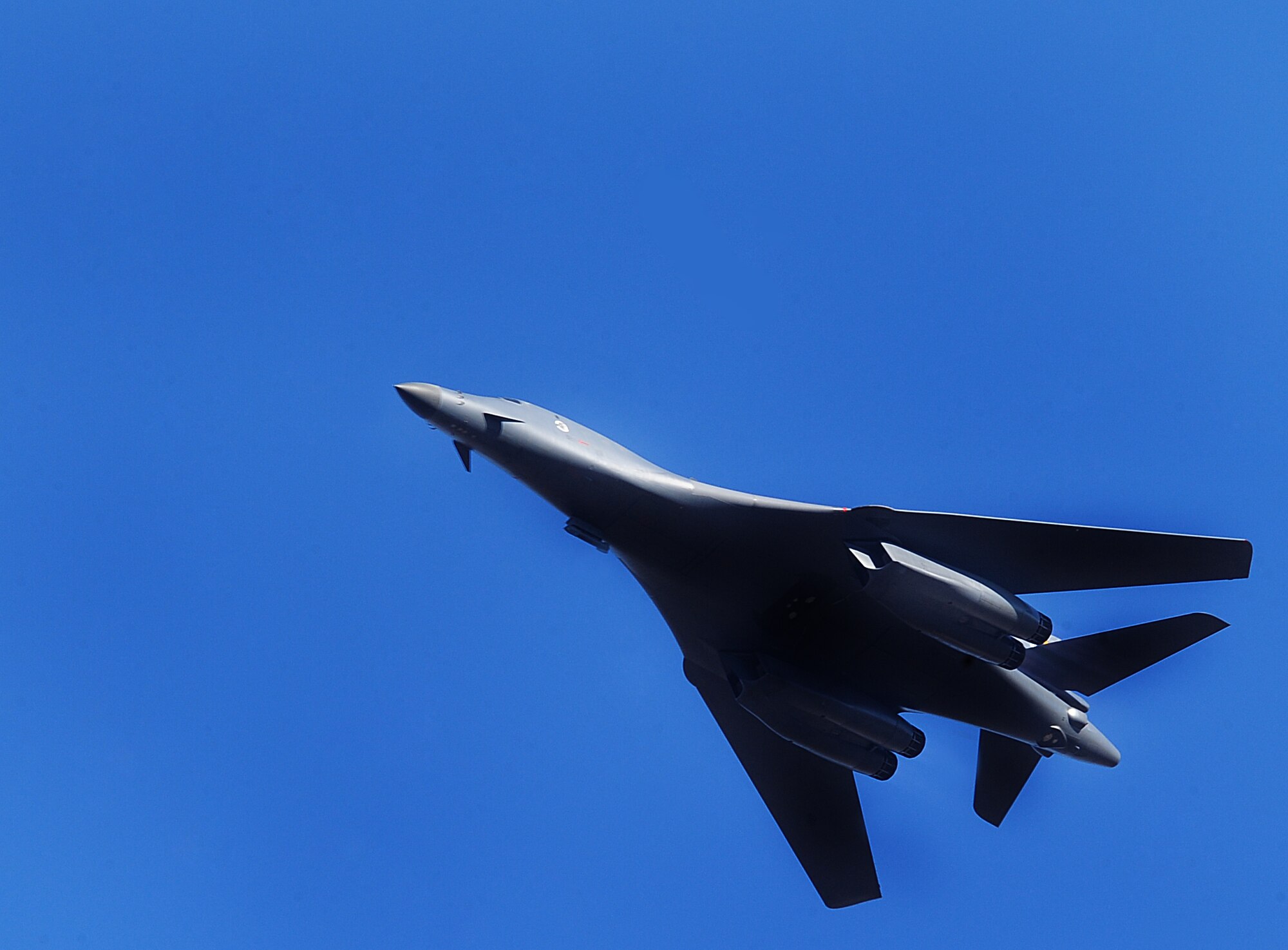 ELLSWORTH AIR FORCE BASE, S.D. -- A B-1B Lancer, with the 37th Bomb Squadron, flies over during a joint-nation training mission with Canadian joint terminal attack controllers in Alzada, MT, Oct. 28.  The B-1 can rapidly deliver massive quantities of precision and non-precision weapons against any adversary, anywhere in the world, at any time. (U.S. Air Force photo/Airman 1st Class Anthony Sanchelli)
