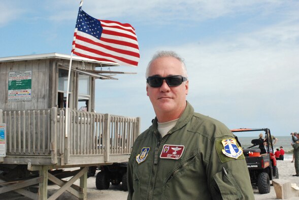 COCOA BEACH, Fla. -  Air Force pararescueman, Senior Master Sgt. Mike Gorsline, 920th Rescue Wing, narrated an astronaut rescue demonstration put on by the 920th RQW during an Air Force Week performance Oct. 29, 2010. The endless summer sanctuary that is Cocoa Beach was the staging spot for Air Force Week 2010, a culmination of recruiting magnificence that happens only twice a year at select locations. The first was in New York City earlier this year. More important than attracting new blood, top Air Force leadership were here honoring the accomplishments and sacrifices of all American. With well over 35,000 Airmen currently deployed across the globe in support of contingency operations, the theme of this Air Force Week is Honoring Hometown Heroes. (U.S. Air Force Photo/Capt. Cathleen Snow)