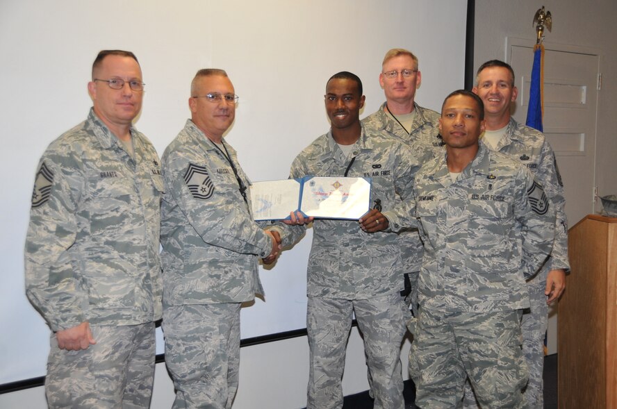 The Kirtland Chiefs’ Group surprised Airman 1st Class Norvaris Grant, 377th Security
Forces Squadron, with a certificate and “Sharp Troop” coin, recognizing his selection as the August 2010 Sharp Troop. Airman Grant was credited for his outstanding
attitude, bearing and professionalism. The Chiefs’ Group Sharp Troop recognizes select Airmen from across Team Kir tland. From lef t, Richard Graves, 377th SFS, Dan
Maucieri, 58th Aircraft Maintenance Squadron, Airman Grant, Paul Cupach, 58th AMXS, Chuck Cremeans, 377th Medical Group, and Jim Patrie, 377th Mission Support Group.