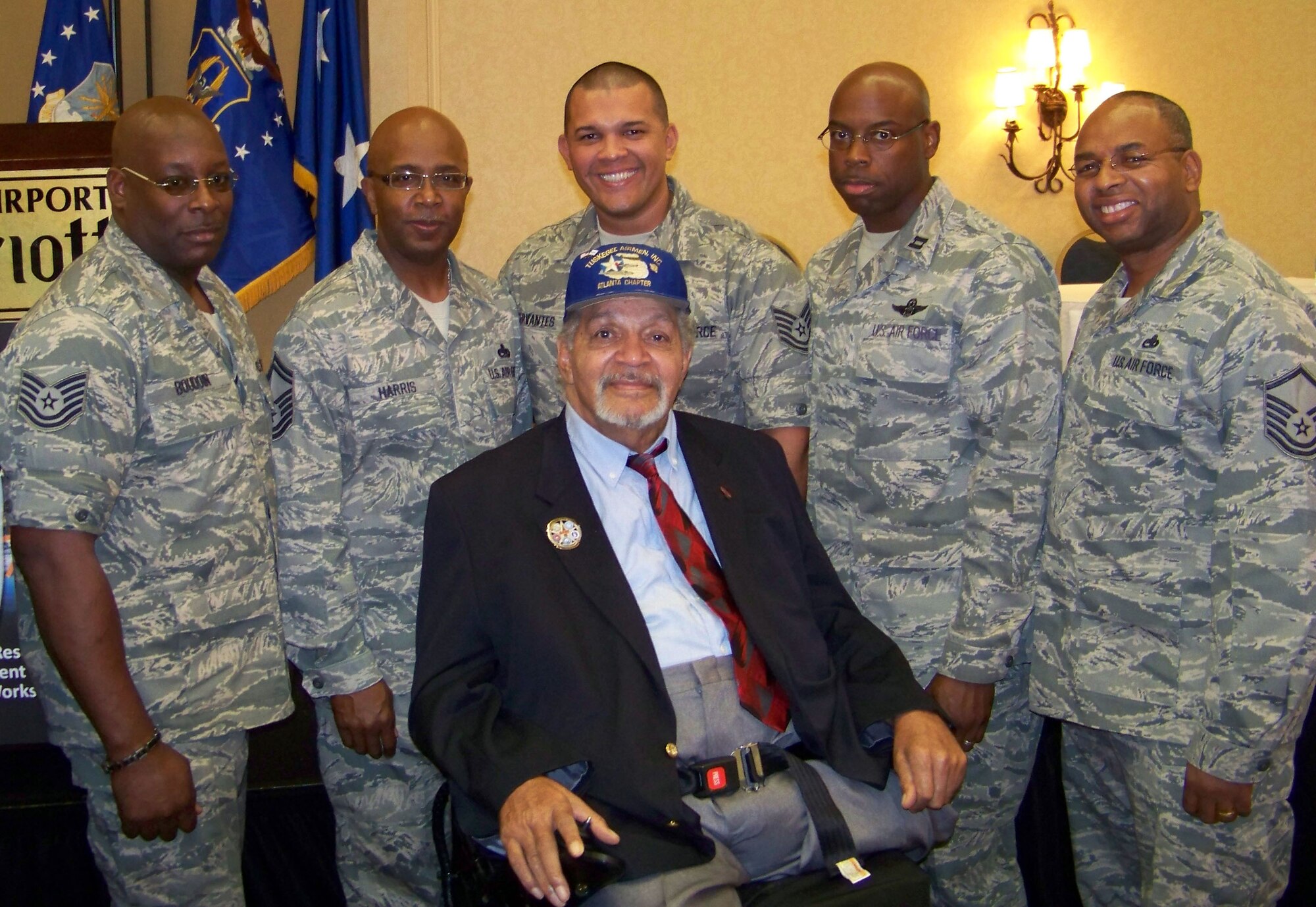 On the right are Capt. Otis Wilson, 512th Airlift Wing Operations Support Flight, and Master Sgt. Alvin Jackson, 712th Aircraft Maintenance Squadron. They, along with other Air Force Reserve Command Airmen, pose for a photo with Tuskegee Airman Ray Williams at the Air Force Reserve Command Human Resources Development Council conference Oct. 24-27, 2010 in Atlanta. (U.S. Air Force photo/released)