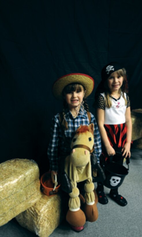 Olivia McGinley, 5, and sister, Lily McGinley, daughters of Col. Ed McGinley, Army Training Support Center, wait in line to experience the awakening of the exhibits.