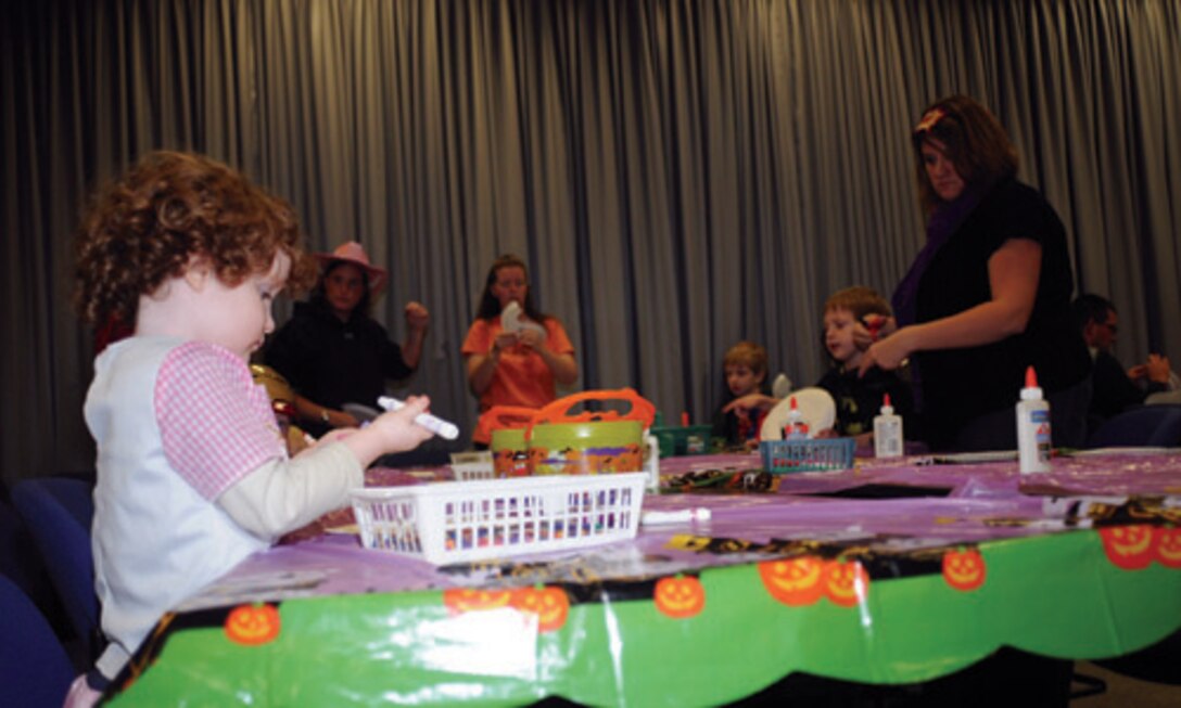 After being tricked and treated by the living exhibits, children gathered in the museum conference room for crafts, coloring and face painting.