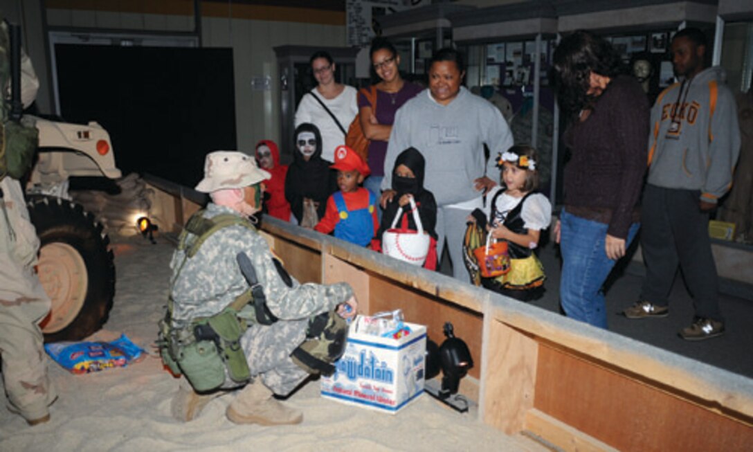 At the Operation Iraqi Freedom station, the latest entry on the Army’s historical timeline, children are “treated” to a visit with Sgt. David Burns, a volunteer from the Army Leadership Course who is also an OIF veteran.

