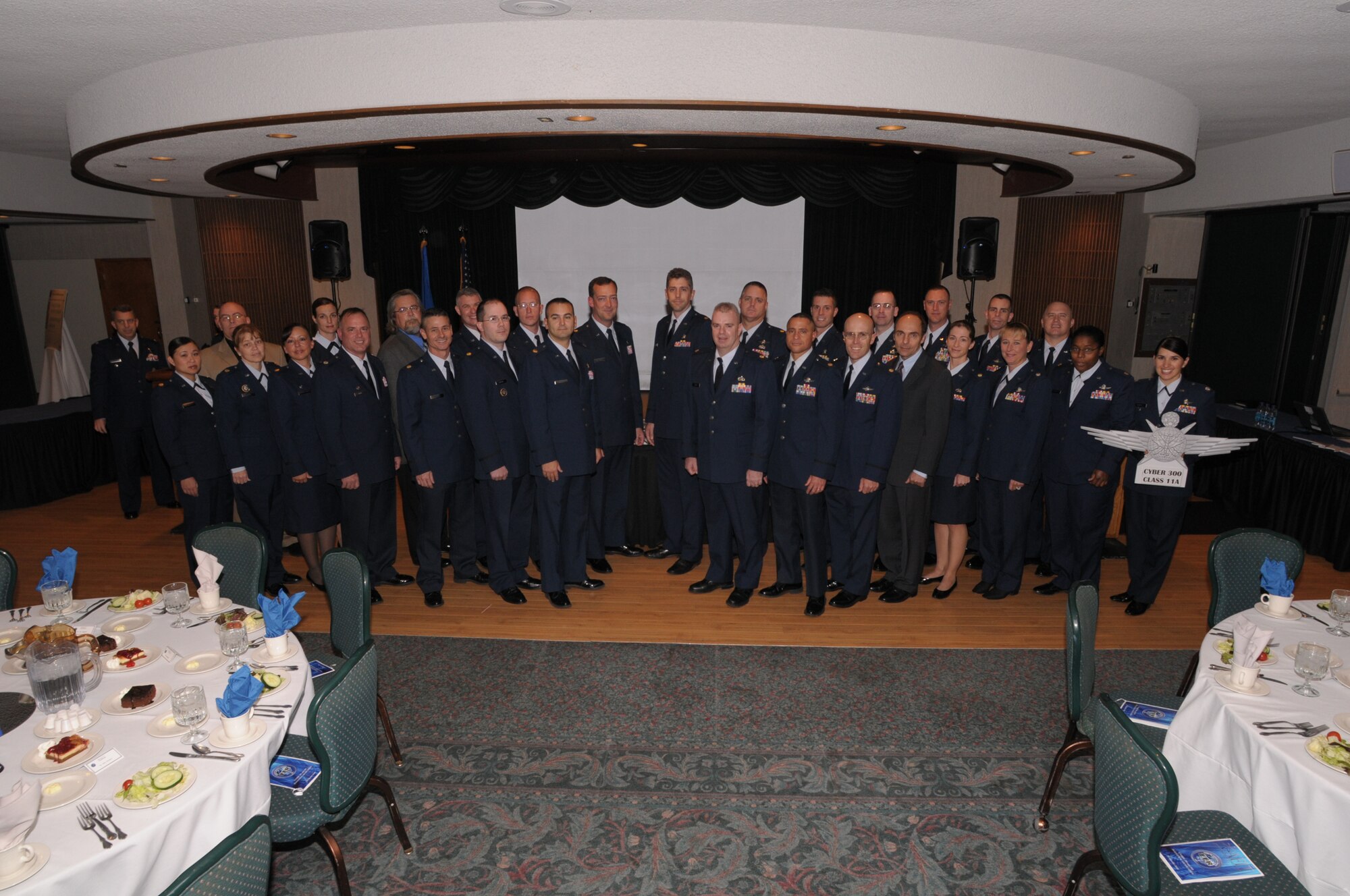 Graduates from the first Air Force Institute of Technology Cyber 300 class pause for a photo during graduation ceremonies, Oct. 28, 2010, at Wright-Patterson Air Force Base, Ohio.  (U.S. Air Force photo/Al Bright)