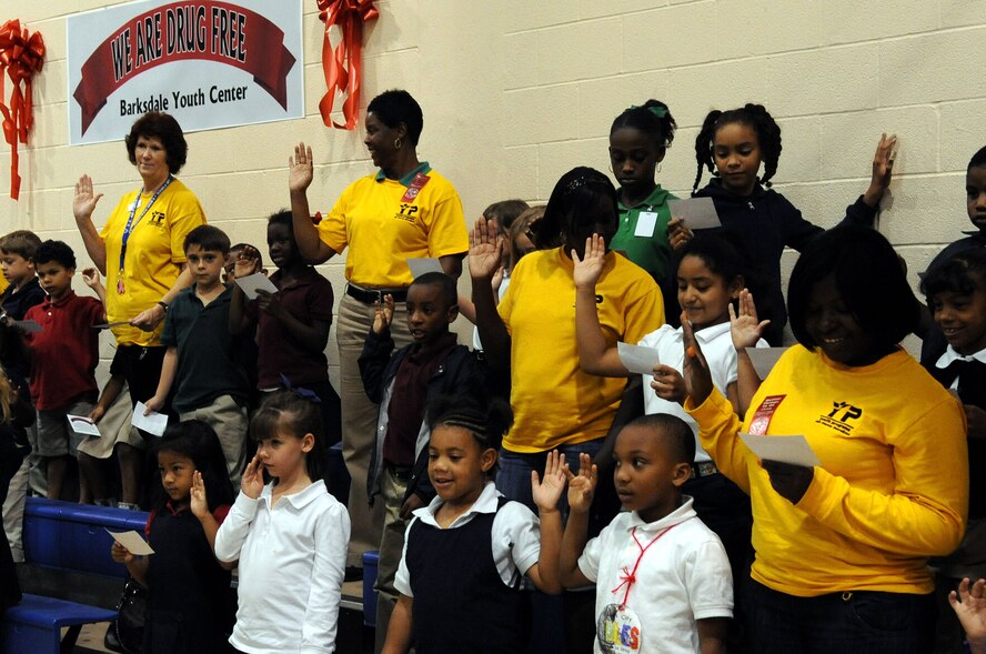 BARKSDALE AIR FORCE BASE, La. -- Barksdale youth and members of the youth center staff take the pledge to be drug free during Red Ribbon Week at the youth center Oct. 28. The Red Ribbon Week Campaign runs each year from Oct. 23-31. (U.S. Air Force photo/Senior Airman La'Shanette V. Garrett)