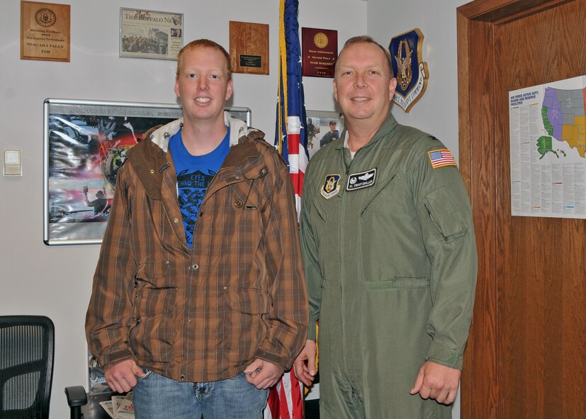 Kenon Swartzmiller is given the Oath of Enlistment his father 914th Airlift Wing Commander Col. Allan L. Swartzmiller, October 29, 2010, Niagara Falls Air Reserve Station, Niagara Falls NY. Swartzmiller is slated to be station with the 315th AES in Charleston SC. (U.S. Air Force photo by Staff Sgt. Joseph McKee)
