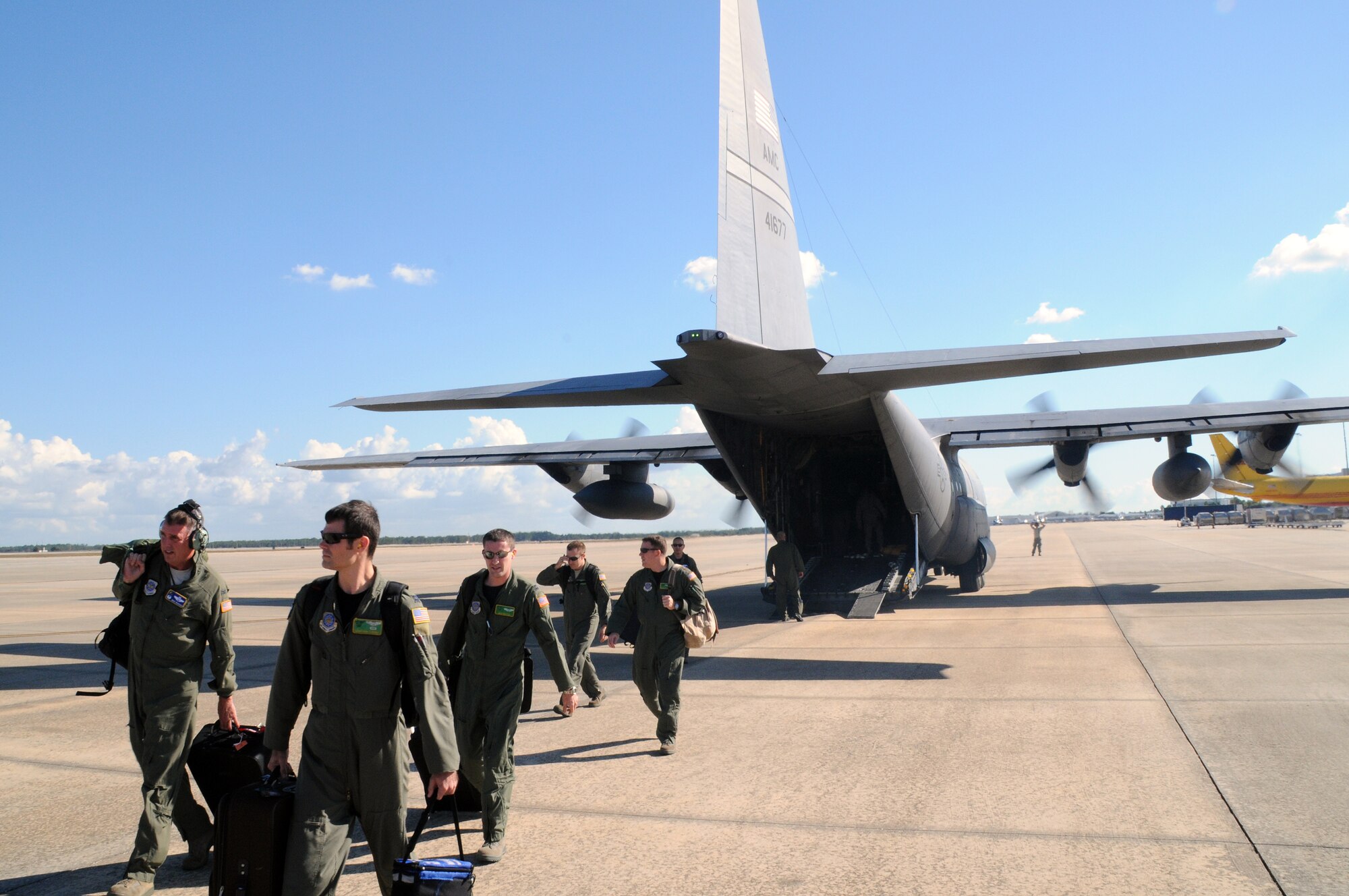 Members of Team Little Rock depart a C-130 Oct. 28 flown by Col. Mike Minihan, 19th Airlift Wing commander, upon their arrival at Orlando international airport, Fla. They’re some of the many representatives from Little Rock Air Force Base attending the Airlift/Tanker Association convention and symposium Oct. 28 – 30. (U.S. Air Force photo by Staff Sgt. Chris Willis)