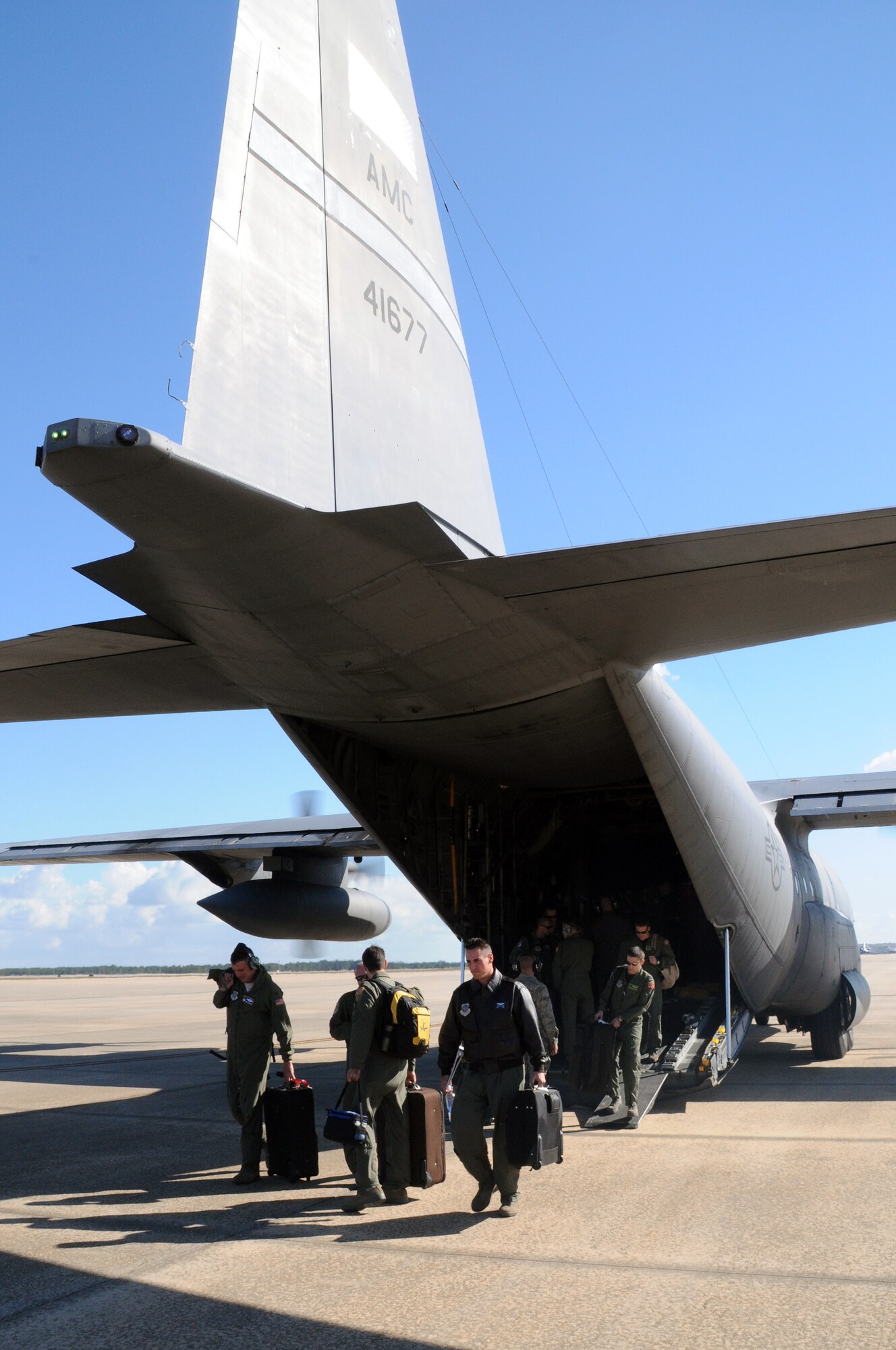 Members of Team Little Rock depart a C-130 Oct. 28 flown by Col. Mike Minihan, 19th Airlift Wing commander, upon their arrival at Orlando international airport, Fla. They’re some of the many representatives from Little Rock Air Force Base attending the Airlift/Tanker Association convention and symposium Oct. 28 – 30. (U.S. Air Force photo by Staff Sgt. Chris Willis)