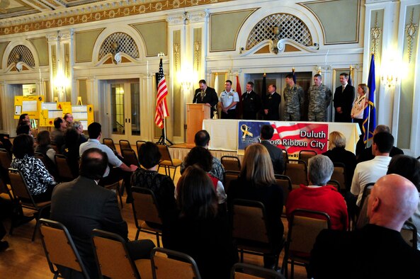 Richard C. Dumancas of the St Louis County Veterans Service Office, starts off the Yellow Ribbon ceremony held on Oct. 28, 2010 at the Greysolon Plaza in Duluth, Minn.  The event was held to celebrate Duluth's recognition as a Yellow Ribbon City from the culmination of work completed by the Beyond the Yellow Ribbon Steering Committee led by co-chairs Richard Dumancas and Jennifer Kuhlman, 148th Fighter Wing Airman and Family Readiness Program Manager.  (U.S. Air Force photo by SSgt Donald Acton)