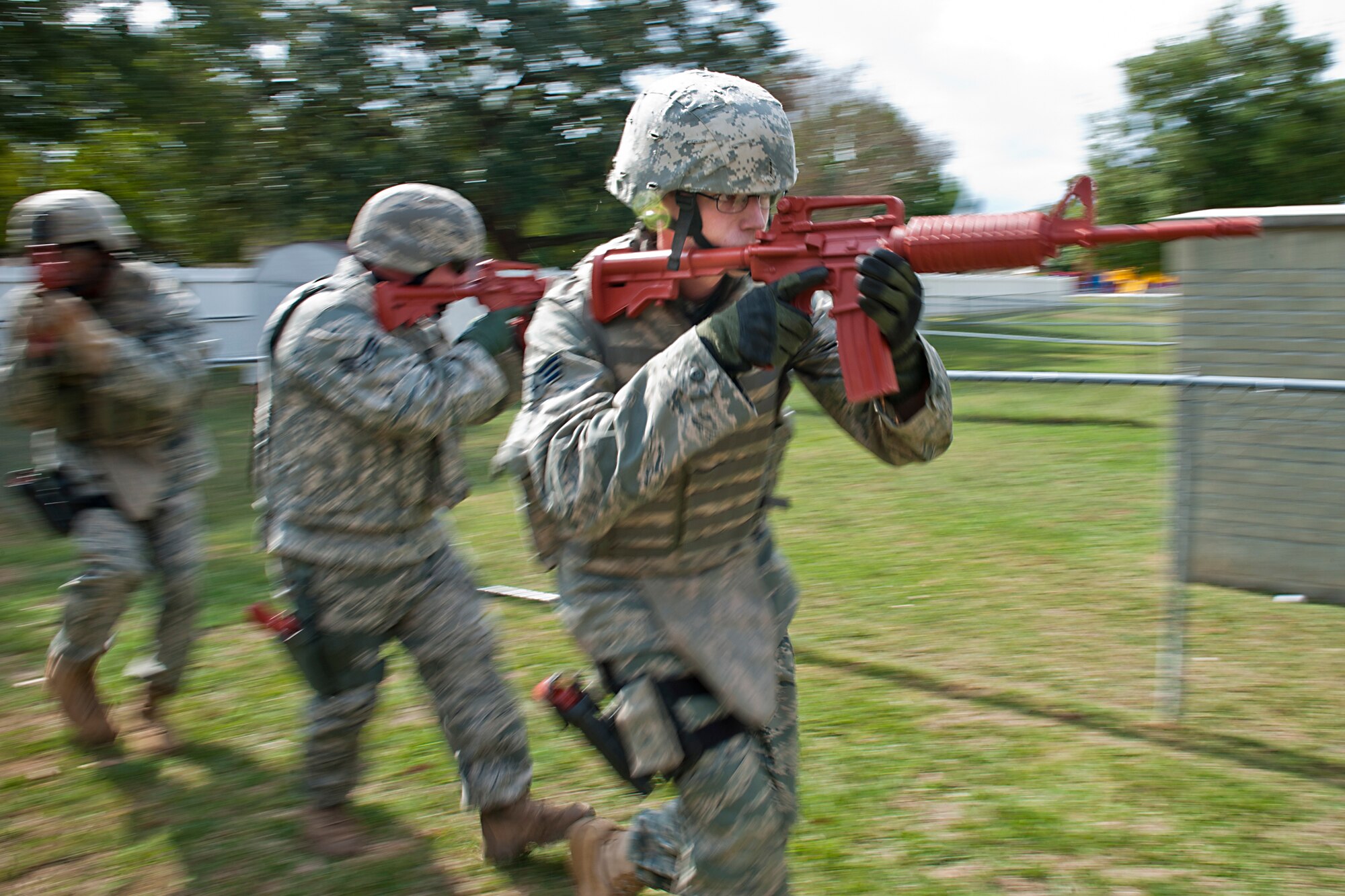MOODY AIR FORCE BASE, Ga. -- Senior Airmen Kyle Vail (front), Cody Maxwell (middle) and David Parham, 822nd Base Defense Squadron patrolmen, perform team tactical movements in part of active shooter training Oct. 28. The tactical movements portion of training covered maintaining good center balance, a sturdy shooting platform and team communication. The team later used the skills during an active shooter scenario played out at base housing. (U.S. Air Force photo/Senior Airman Jamal D. Sutter)(RELEASED)