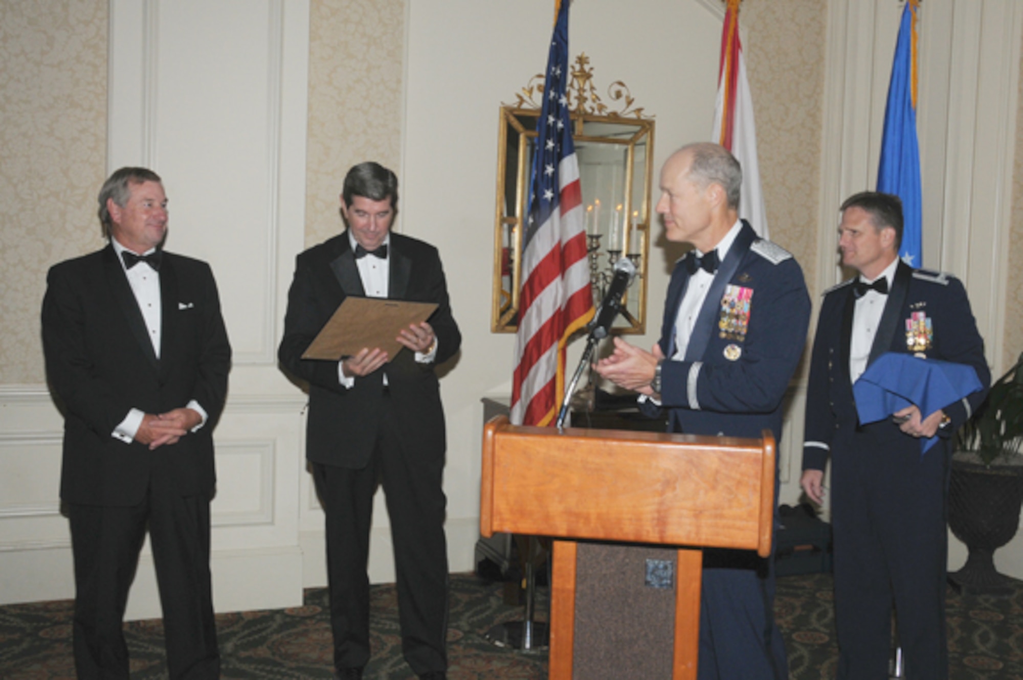 Montgomery Mayor Todd Strange, Alabama Governor Bob Riley, Air University Commander Lt. Gen. Allen Peck, and Col. Jeff Dunn, LeMay Center vice commander participate in a Dining Out last week hosted by Air University and the Montgomery Area Chamber of Commerce. The event commemorated the 100th Anniversary of the Wright Brothers' flying school, located at what is now Maxwell Air Force Base. (Air Force photo/Wendy Simonds)