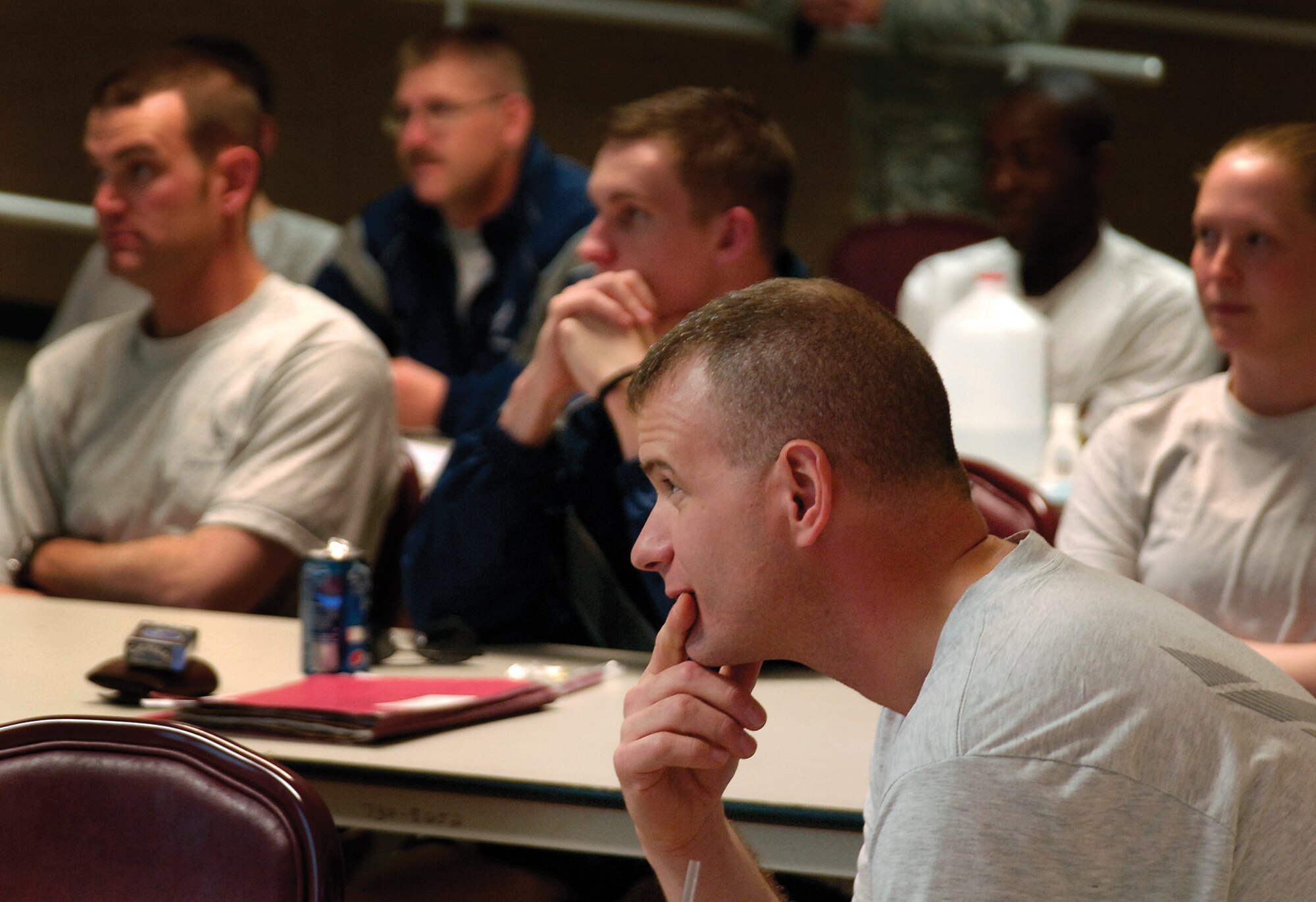 Capt. Robert Prausa and Airmen of the 72nd Security Forces Squadron adjust to life back home after duty called them to war for six months. A reintegration briefing brought in Tinker’s agencies to help smooth the return to their families and regular life. Mental health, Family Advocacy, chapel and veteran’s services representatives talked with each Airman Oct. 21 to offer help where needed. (Air Force photo by Margo Wrightz)