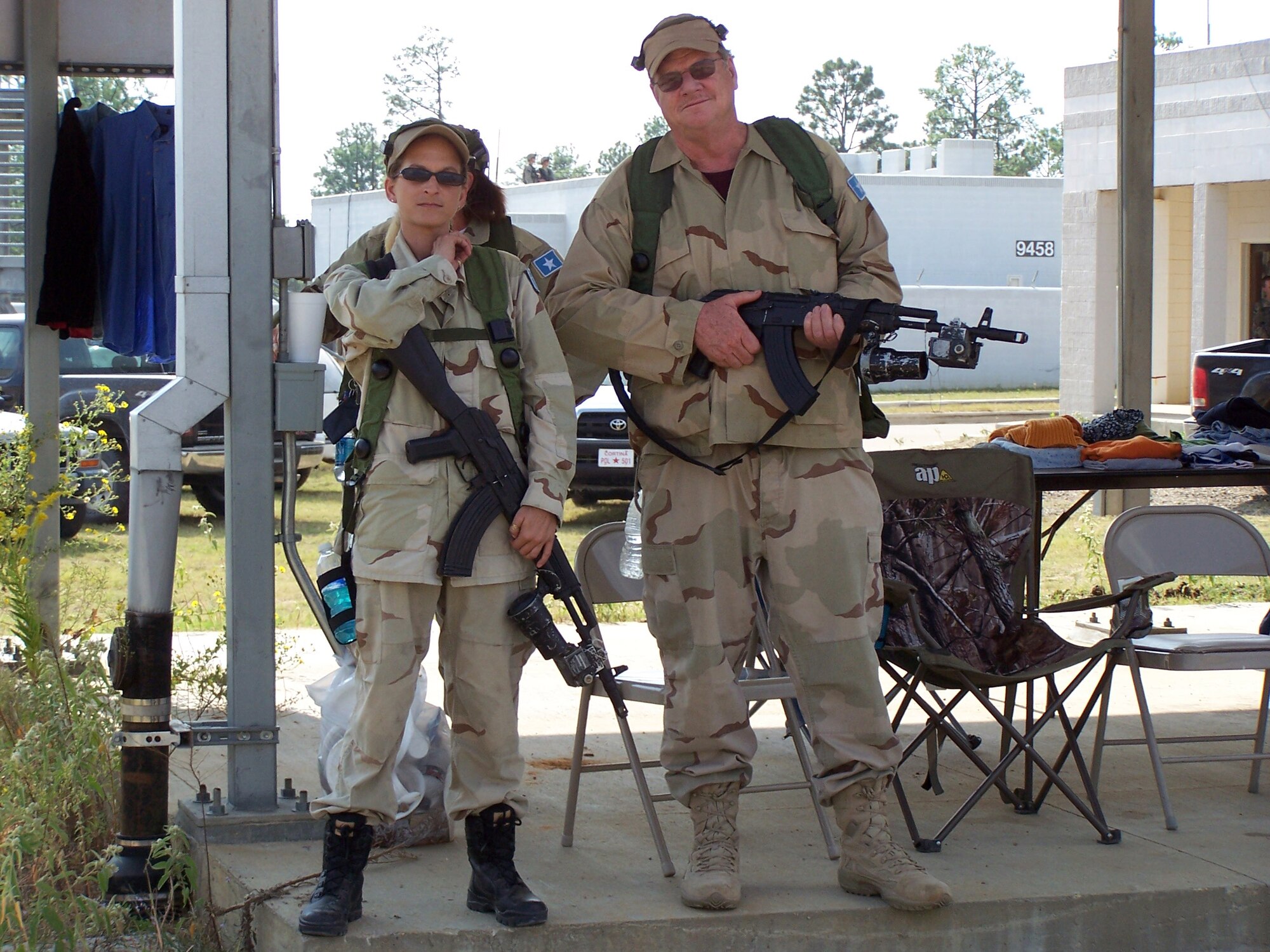FORT POLK, LA. – Two role players portray the host country’s army during Green Flag East on Oct. 21. Role players portraying citizens, army and opposition forces wear the same instrumented vest that tracks their movements. This information was integrated into a virtual and constructive environment. (U.S. Air Force photo/Noel Getlin)