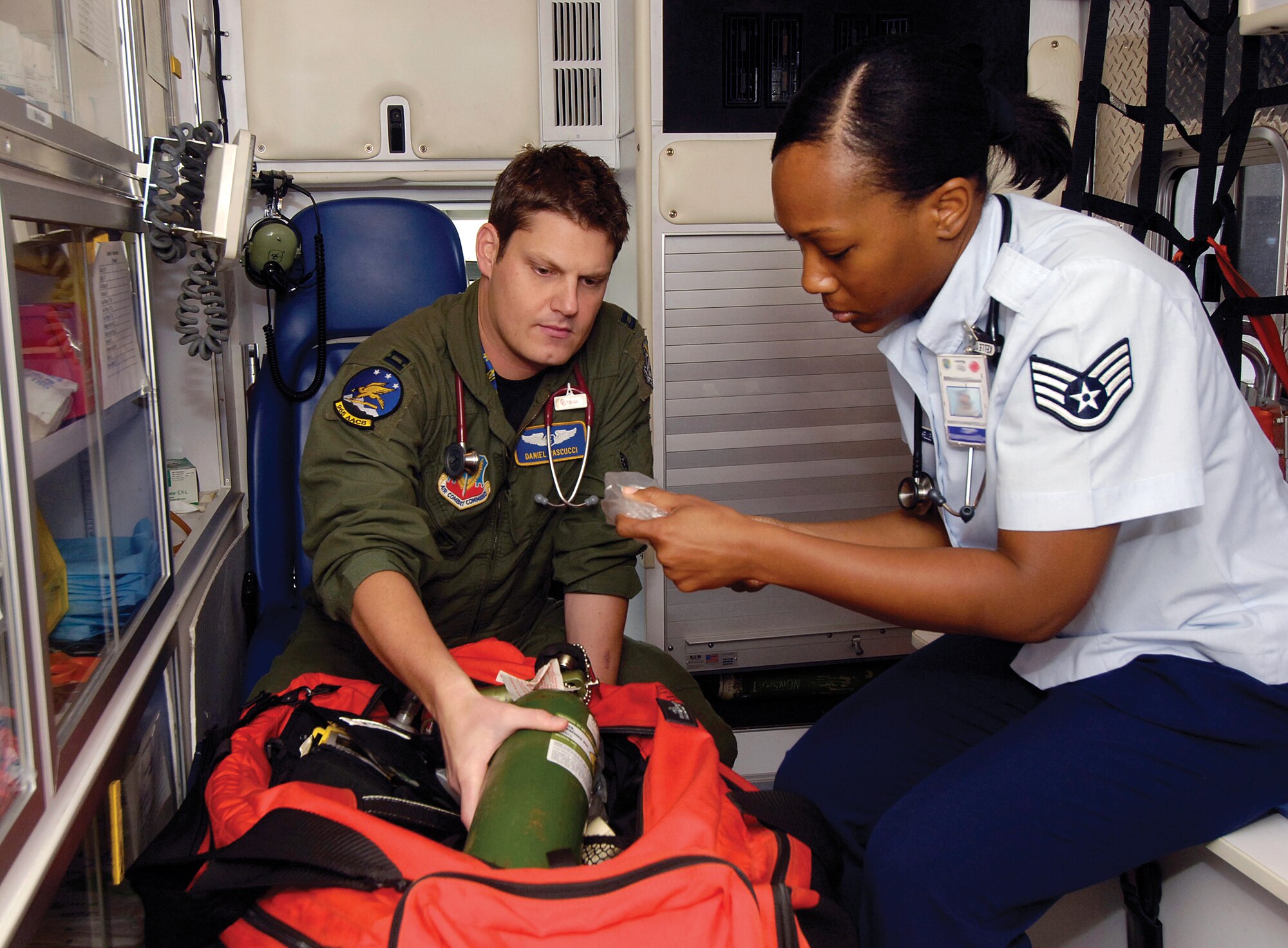 Dr. (Capt.) Dan Pascucci and Staff Sgt. Brandi Kelley check a 72nd Medical Group ambulance to ensure it’s ready for any in-flight emergency calls. Both are with the 965th Airborne Air Control Squadron, caring for 350 people in their squadron and also serving Tinker’s Airmen in the Flight Medicine Clinic. Sergeant Kelley is an independent duty medical technician who works closely with Dr. Pascucci. Here, and especially during deployments, the “super medic” works side-by-side with Dr. Pascucci on all aspects of patient care. (Air Force photo by Margo Wright)