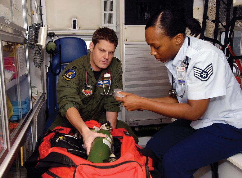 Dr. (Capt.) Dan Pascucci and Staff Sgt. Brandi Kelley check a 72nd Medical Group ambulance to ensure it’s ready for any in-flight emergency calls. Both are with the 965th Airborne Air Control Squadron, caring for 350 people in their squadron and also serving Tinker’s Airmen in the Flight Medicine Clinic. Sergeant Kelley is an independent duty medical technician who works closely with Dr. Pascucci. Here, and especially during deployments, the “super medic” works side-by-side with Dr. Pascucci on all aspects of patient care. (Air Force photo by Margo Wright)