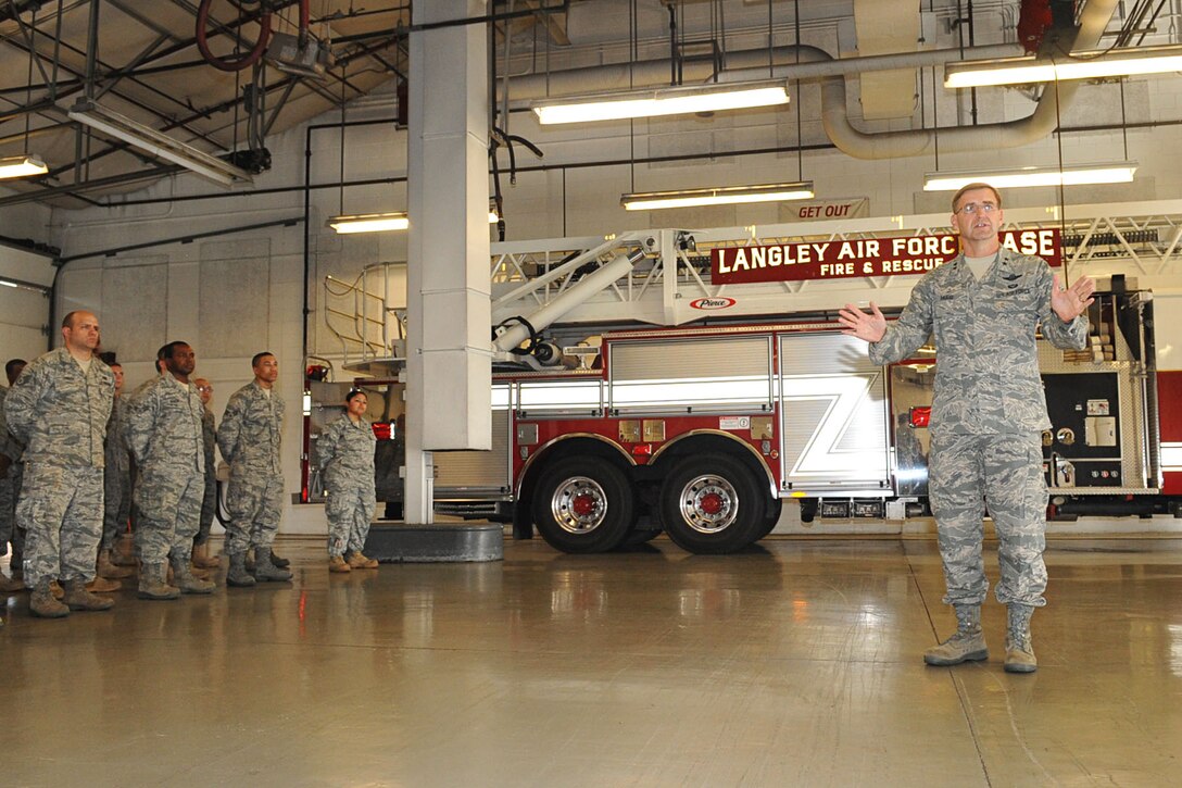 LANGLEY AIR FORCE BASE, Va. -- Maj. Gen. Stephen L. Hoog, 9th Air Force commander, congratulates the 633d Air Base Wing Civil Engineer fire department on their quarterly award wins during his visit Oct. 26. General Hoog toured the entire base, as well as Fort Eustis, to gain greater knowledge of the Airmen, Soldiers and improvement projects across the joint base. (U.S. Air Force photo/Staff Sgt. Ashley Hawkins)(RELEASED)