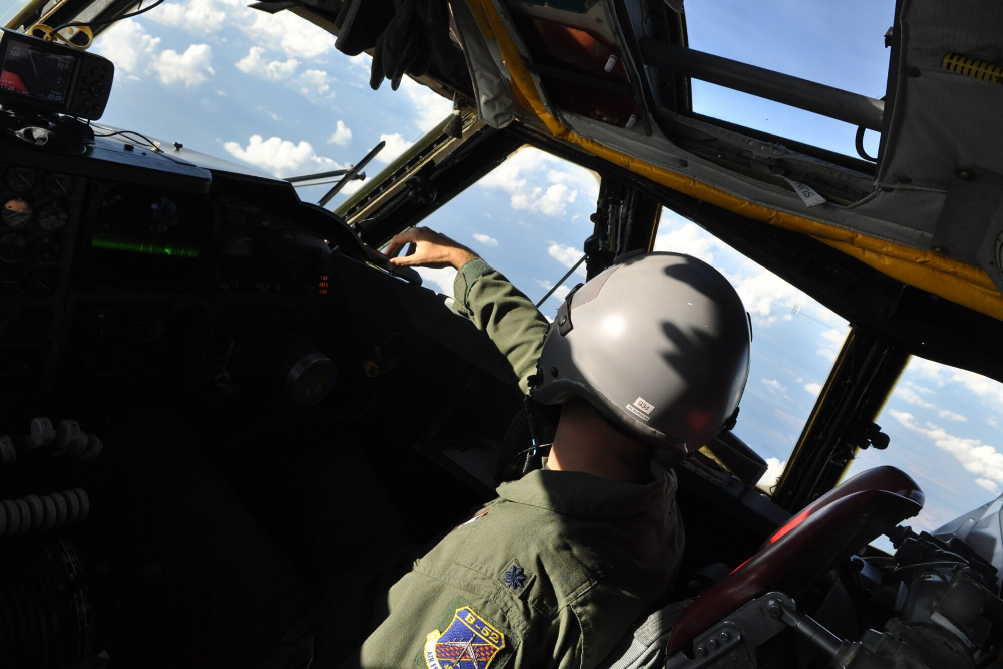 Lt. Col. Robert Burgess, an instructor pilot for the 93rd Bomb Squadron at Barksdale Air Force Base, La., can’t help but admire the massive cloud formation to his right during a simulated bombing mission in a B-52 Stratofortress while on a training sortie to the Claiborne Bombing and Gunnery Range near Alexandria, La., Oct. 27, 2010. (U.S. Air Force photo/Tech. Sgt. Jeff Walston)