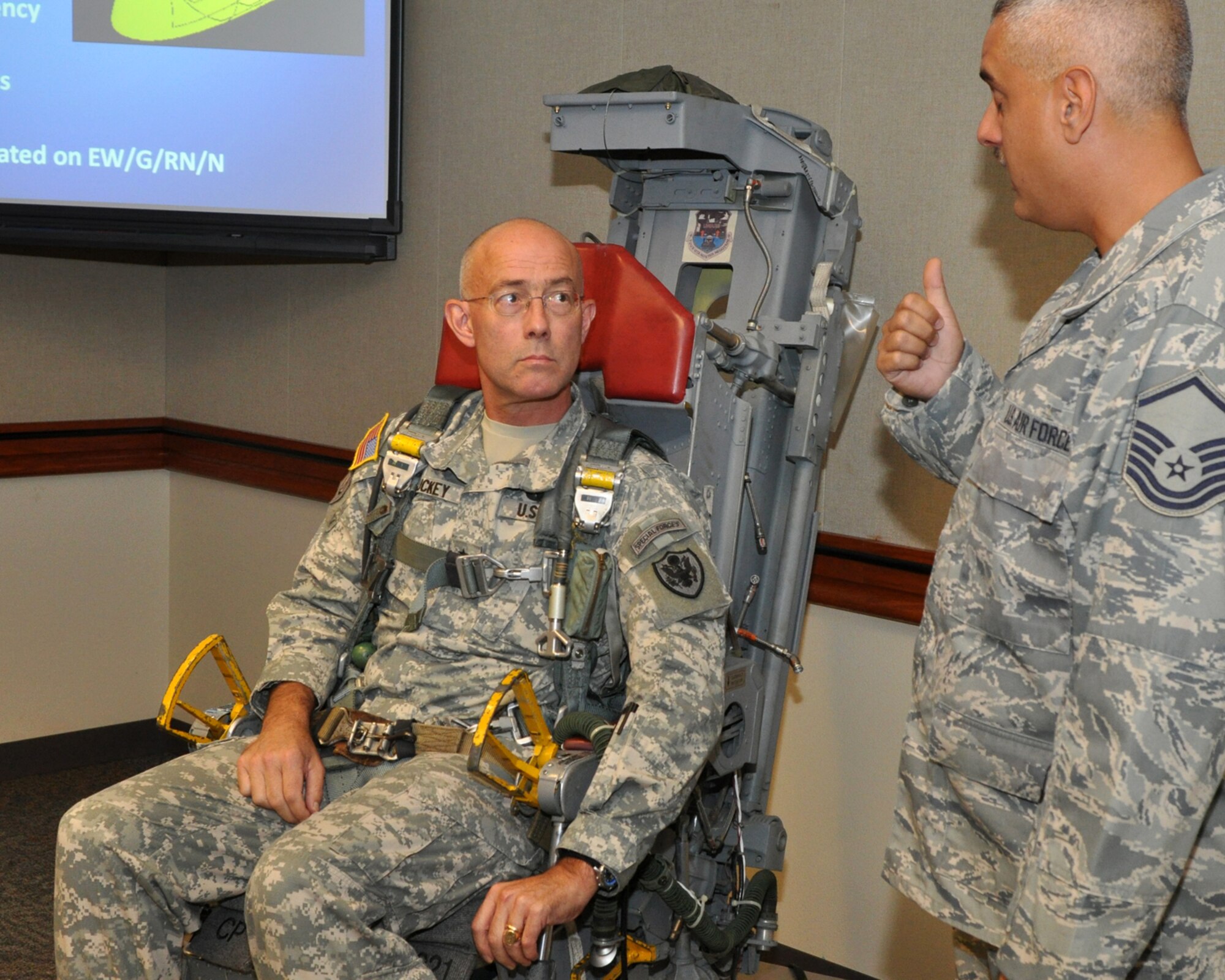 Master Sgt. Bradley Schoth, 917th Operations Support Flight, non-commissioned officer in charge of aircrew flight equipment instructs Maj. Gen. Charles D. Luckey in emergency egress and parachute training in the 93rd Bomb Squadron Headquarter building at Barksdale Air Force Base, La., Oct. 27, 2010. General Luckey is a U.S. Army officer, and is the Assistant to the Chairman of the Joint Chiefs of Staff for Reserve Matters. He was visiting the 917th Wing at Barksdale to get a general feel for issues affecting the Reserve component. He made his first flight in a B-52 Stratofortress that same afternoon. (U.S. Air Force photo/Tech. Sgt. Jeff Walston) 