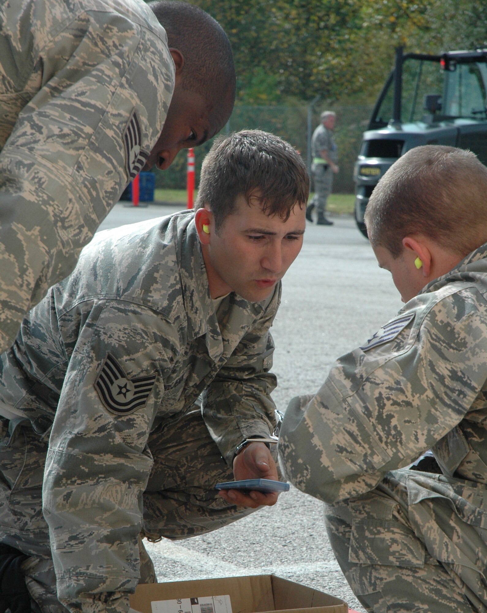 Port Dawgs from the 41st Aerial Port Squadron, Keesler Air Force Base, Miss., complete final calculations in their demonstration of measuring and securing cargo during the Restraint competition at Port Dawg Competition at Dobbins Air Reserve Base, Ga. The Air Force Reserve Command-sponsored competition focused on teamwork, safety and camaraderie. Twenty-two teams from AFRC gathered at Dobbins ARB to compete at this command event. (U.S. Air Force photo/Senior Airman Danielle Campbell)
