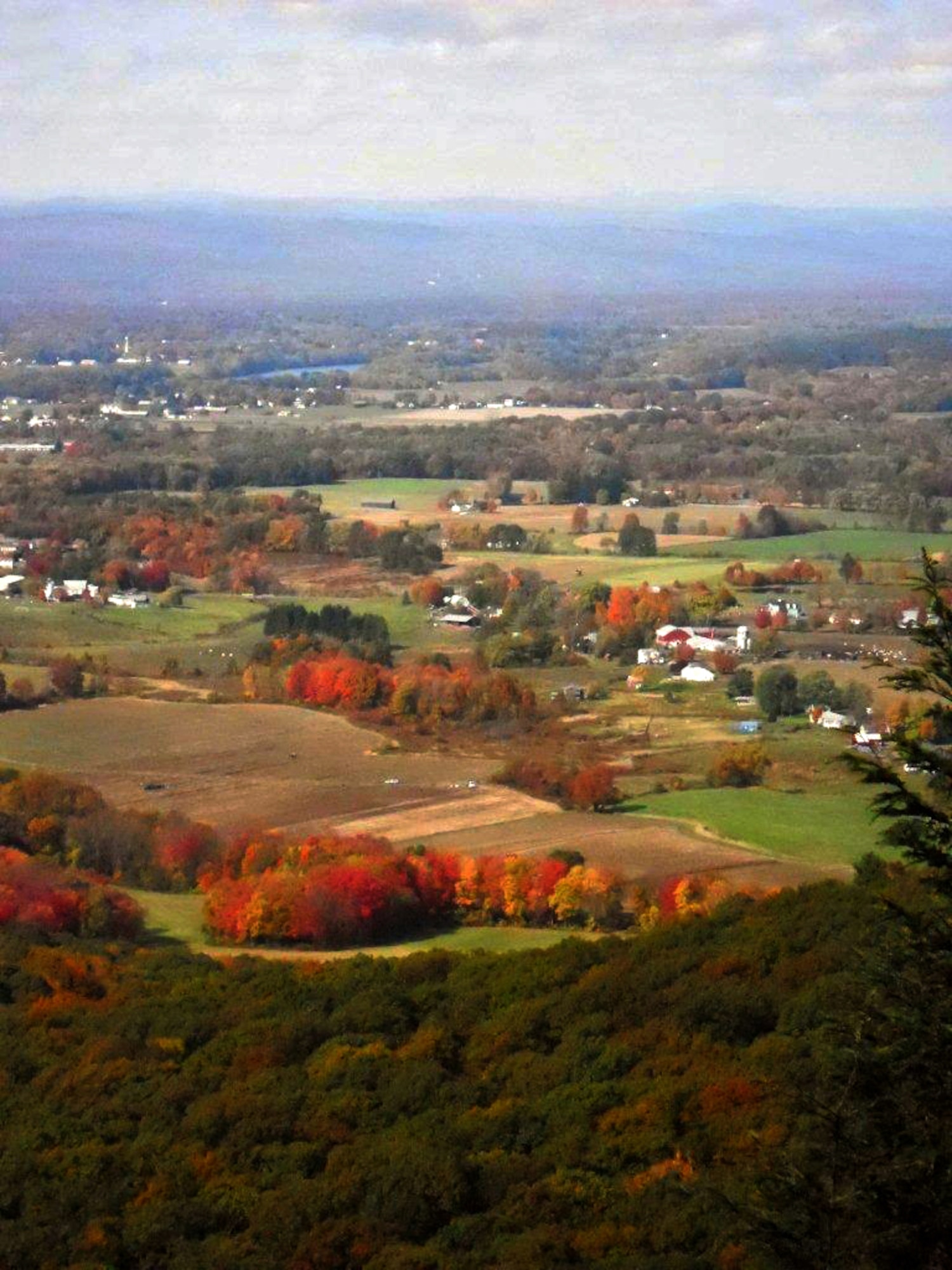 The foliage and fields of the Pioneer Valley in Hadley, Mass., spread outbeneath the Seven Sisters Trail.  The locally-famous trail is five mileslong (one way) and runs between The Notch Visitor and Skinner State Park inSouth Hadley. Hikers who don't want to do the whole five miles will find anyportion of the trail moderate to strenuous with rewarding views.