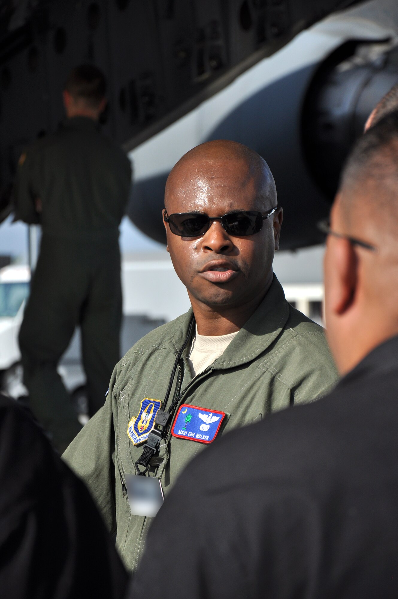 Master Sgt. Eric Walker, A loadmaster with the 315th Airlift Control Flight, discusses loading details with Department of Homeland Security’s Pod Support Team 5 during airlift load certification training Oct. 28 at Joint Base Charleston, S.C. (U.S. Air Force Photo/ Airman 1st Class Robert Pilch)