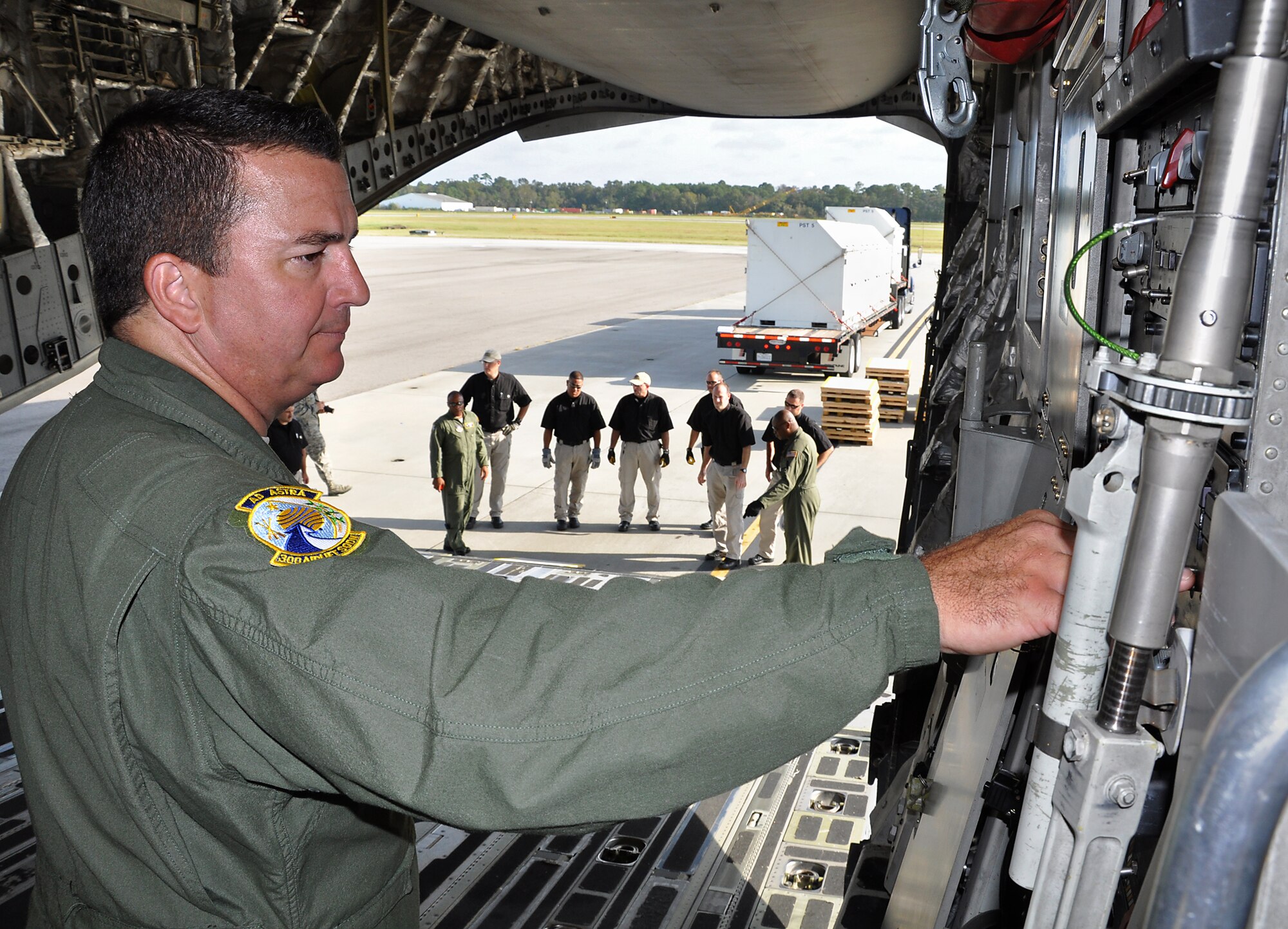 Staff Sgt. Dave Whitmill, a loadmaster with the 315th Airlift Control Flight, lowers the ramp on a C-17 Globemaster III during airlift load certification training Oct. 28 at Joint Base Charleston, S.C.  (U.S. Air Force Photo/Michael Dukes)