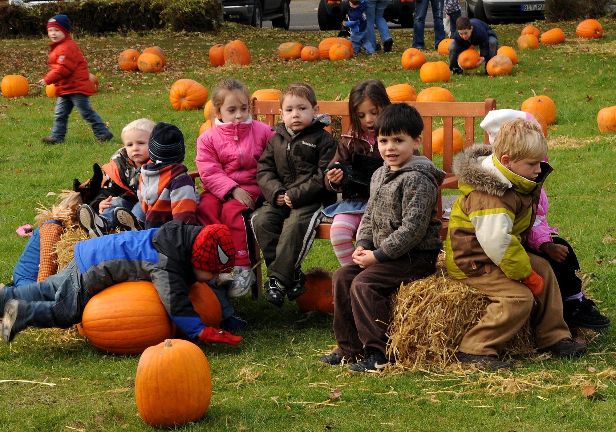 SPANGDAHLEM AIR BASE, Germany – Children from the Spangdahlem Elementary School wait for their classmates to pick out pumpkins for their families after picking out pumpkins of their own Oct. 27. Children from Spangdahlem’s day care and elementary school came to the pumpkin patch to select a pumpkin for their family and have their picture taken. (U.S. Air Force photo/Airman 1st Class Matthew B. Fredericks)