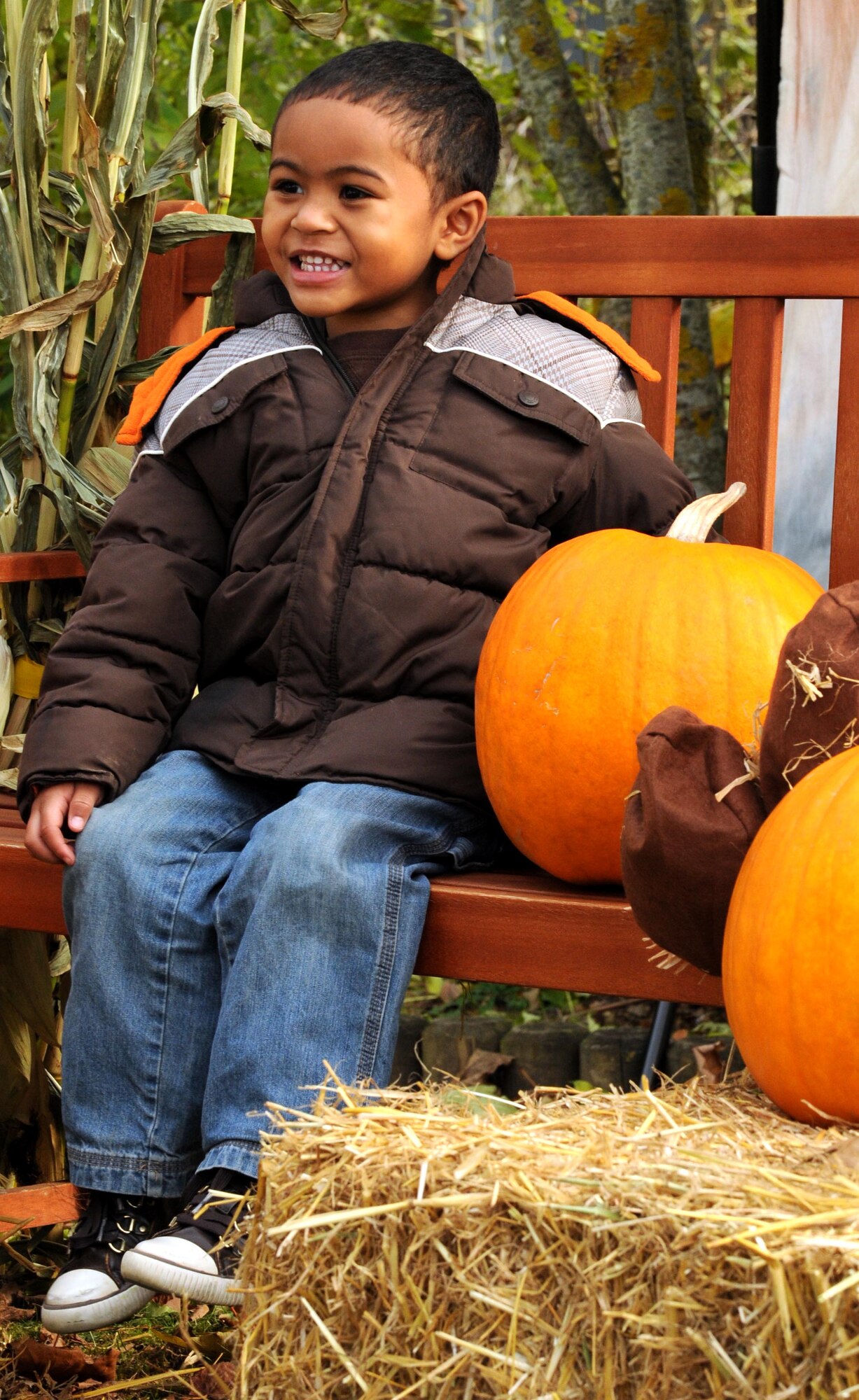 SPANGDAHLEM AIR BASE, Germany – Isaac Bone, 3, son of Staff Sgt. Florencio Bone, 52nd Aerospace Medicine Squadron, poses for a picture near a pumpkin patch Oct. 27. Children from Spangdahlem’s day care and elementary school came to the pumpkin patch to select a pumpkin for their family and have their picture taken. (U.S. Air Force photo/Airman 1st Class Matthew B. Fredericks)