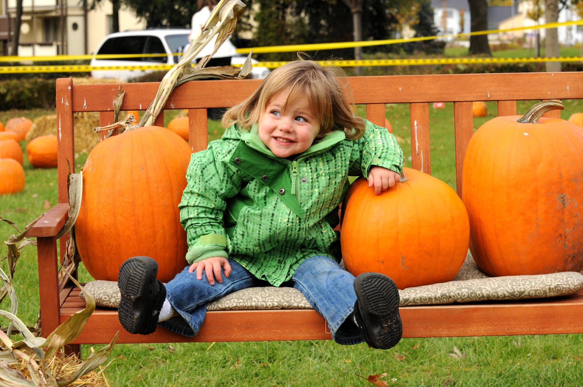 SPANGDAHLEM AIR BASE, Germany – Falan Rhoads, 2, daughter of Staff Sgt. Ashleigh Rhoads, 52nd Communications Squadron, takes a break from looking for the right pumpkin for her family Oct. 27. Children from Spangdahlem’s day care and elementary school came to the pumpkin patch to select a pumpkin for their family and have their picture taken. (U.S. Air Force photo/Airman 1st Class Matthew B. Fredericks)