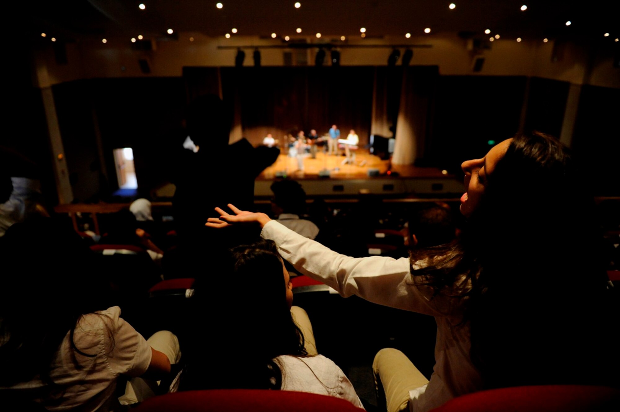 Students sing along and cheer for U.S. Air Forces Central Band "Galaxy" during a performance at King's Academy in Madaba, Jordan, Oct. 27, 2010.  Galaxy performs for audiences throughout Southwest Asia to help build relations with international partners.  (U.S. Air Force Photo/Staff Sgt. Eric Harris)