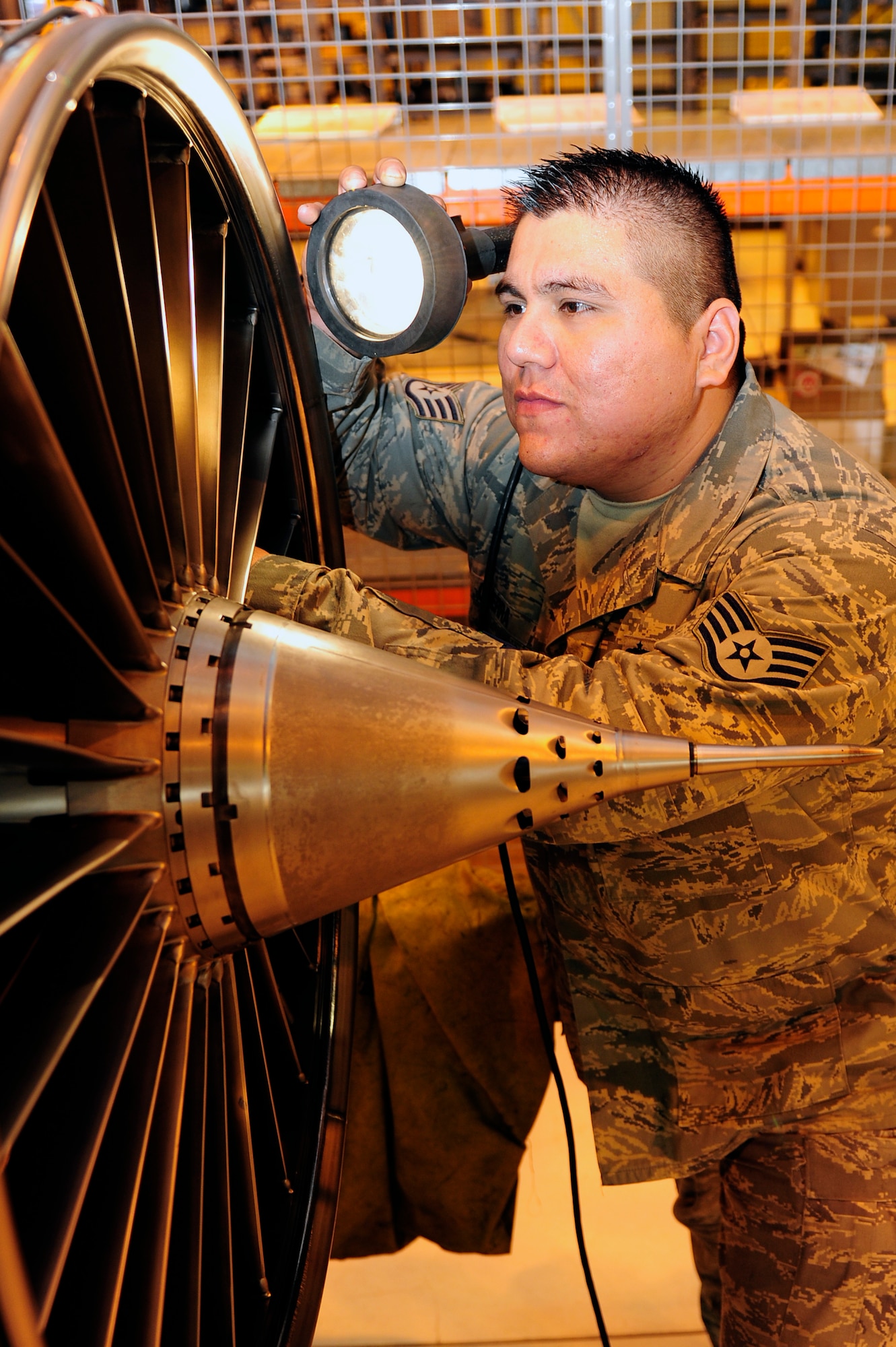 ROYAL AIR FORCE LAKEAHEATH, England--Staff Sgt. Daniel Guerra,48th Component Maintenance Squadron aerospace propulsion craftsman, inspects a fan at the props shop Oct. 27. Sergeant Guearra was selected for the Liberty Spotlight because he displayed the core value of 'Service Before Self'. (U.S. Air Force photo/Airman1st Class Eboni Knox)