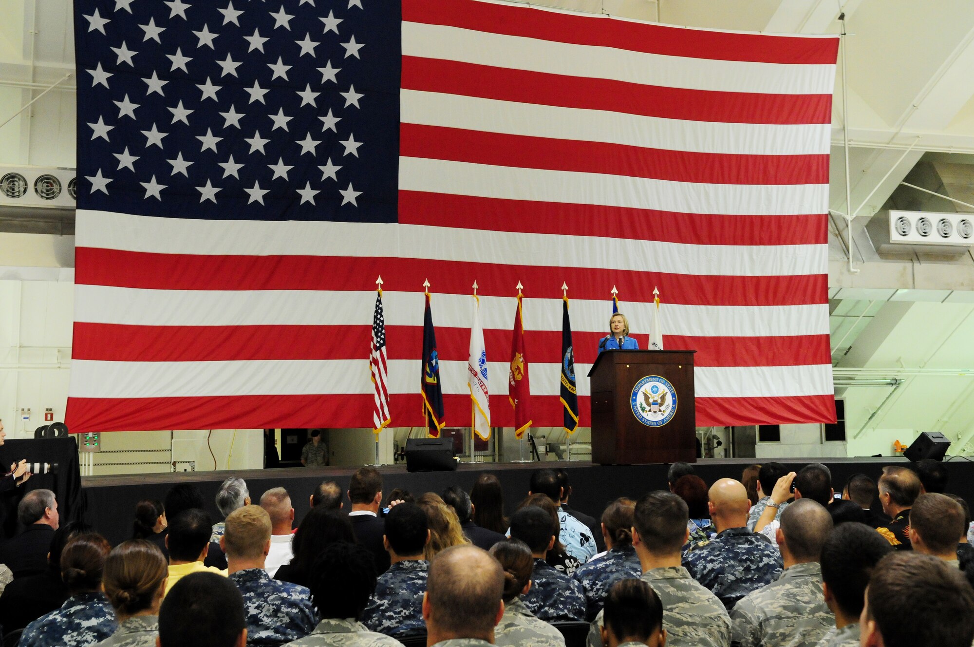 Secretary of State of the United States Hillary Rodham Clinton speaks to more than 1,000 Airmen, Soldiers, Sailors and Marines at Andersen Air Force Base Oct. 29, 2010. Clinton visited the base as part of her trip to the Asia-Pacific Region. She reaffirmed Guam?s importance to the nation, and her gratitude to the service members for their dedication and sacrifice.  (U.S. Air Force photo /Senior Airman Nichelle Anderson/ released)