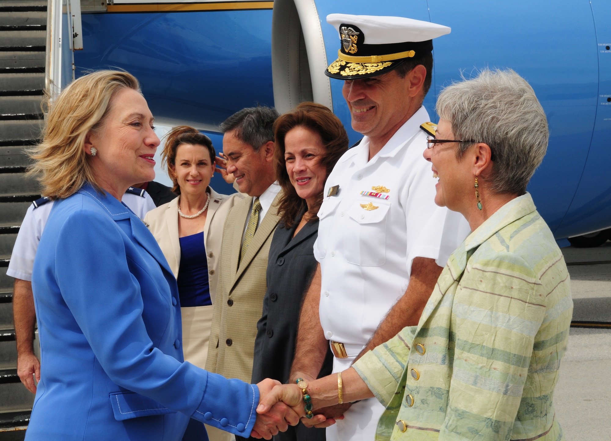 Secretary of State of the United States Hillary Rodham Clinton greets Joint Region Marianas Commander, Rear Adm. Paul J. Bushong and wife Dona Bushong after arrival to Andersen Air Force Base Oct. 29, 2010. Clinton visited the base as part of her trip to the Asia-Pacific Region. She reaffirmed Guam?s importance to the nation, and her gratitude to the service members for their dedication and sacrifice.  (U.S. Air Force photo /Senior Airman Nichelle Anderson/ released)