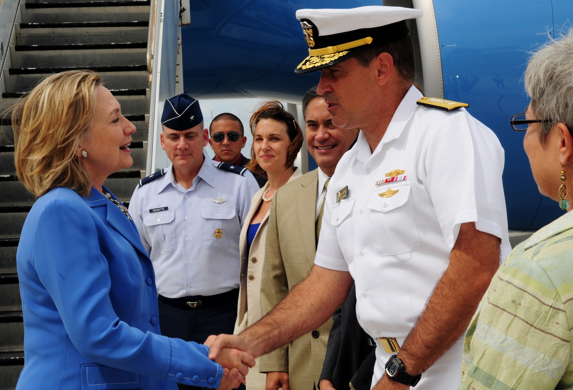 Secretary of State of the United States Hillary Rodham Clinton greets Joint Region Marianas Commander, Rear Adm. Paul J. Bushong and wife Dona Bushong after arrival to Andersen Air Force Base Oct. 29, 2010. Clinton visited the base as part of her trip to the Asia-Pacific Region. She reaffirmed Guam?s importance to the nation, and her gratitude to the service members for their dedication and sacrifice.  (U.S. Air Force photo /Senior Airman Nichelle Anderson/ released)