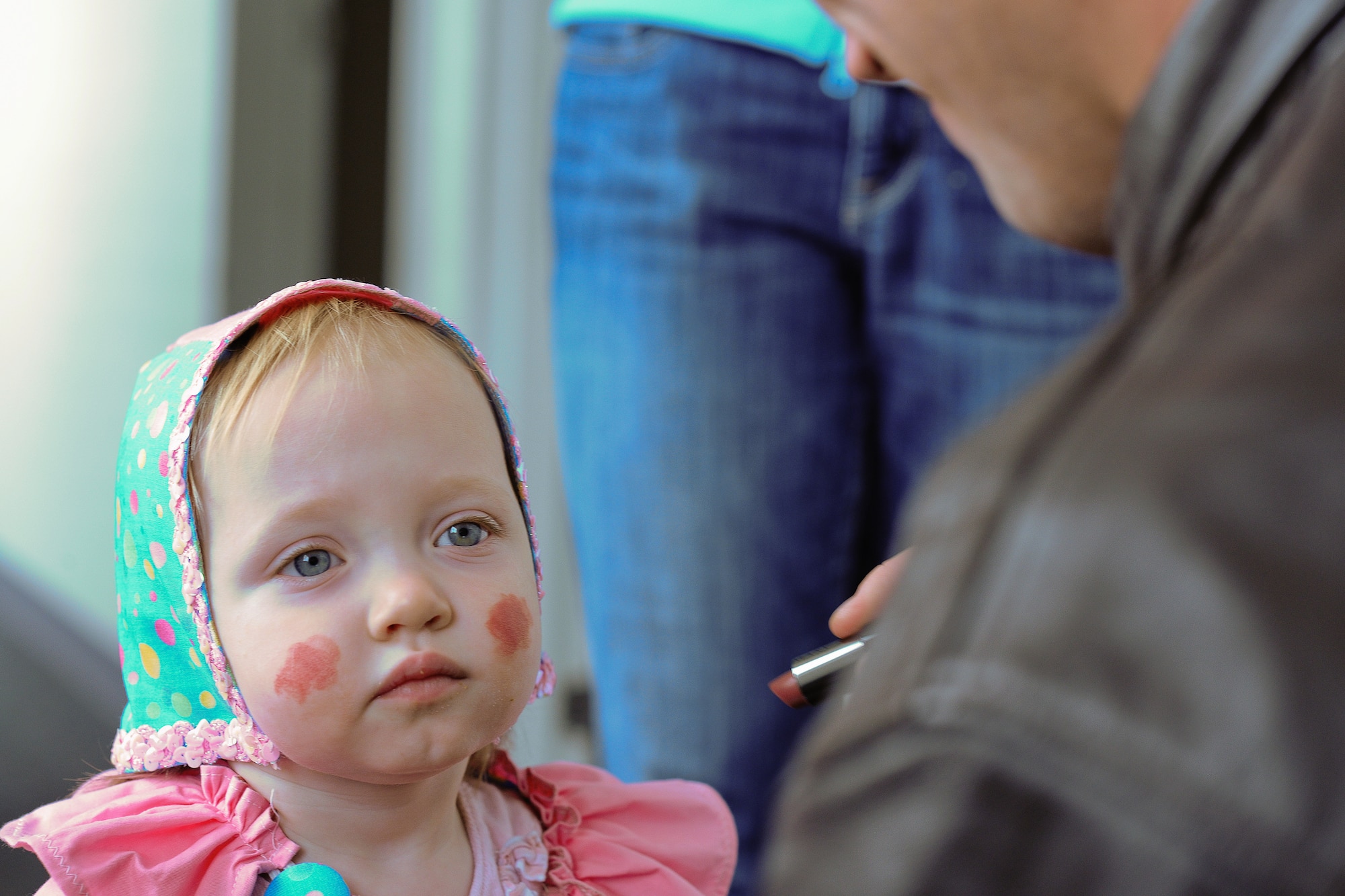 YOKOTA AIR BASE, Japan -- Capt. William Dunn, 36th Airlift Squadron, paints his daughter's, Ashley, face here, during the 374th Operations Group's 2nd Annual Family trick-or-treat, Friday. (U.S. Air Force photo/Osakabe Yasuo)
