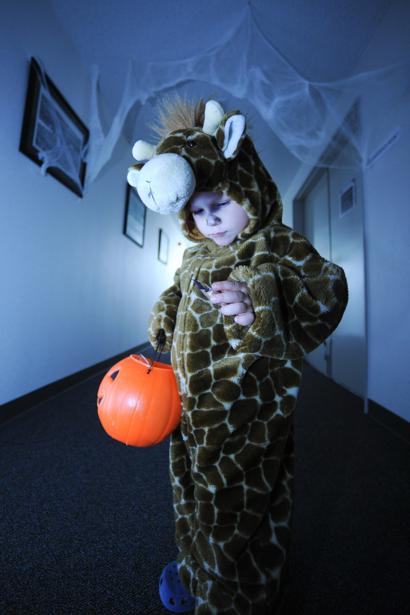 YOKOTA AIR BASE, Japan -- YOKOTA AIR BASE, Japan -- Michael Porter, Age 3, enjoys trick-or-treating in his father's workplace during the 374th Operation Group's 2nd Annual Family trick-or-treat, Friday.  (U.S. Air Force photo/Osakabe Yasuo)