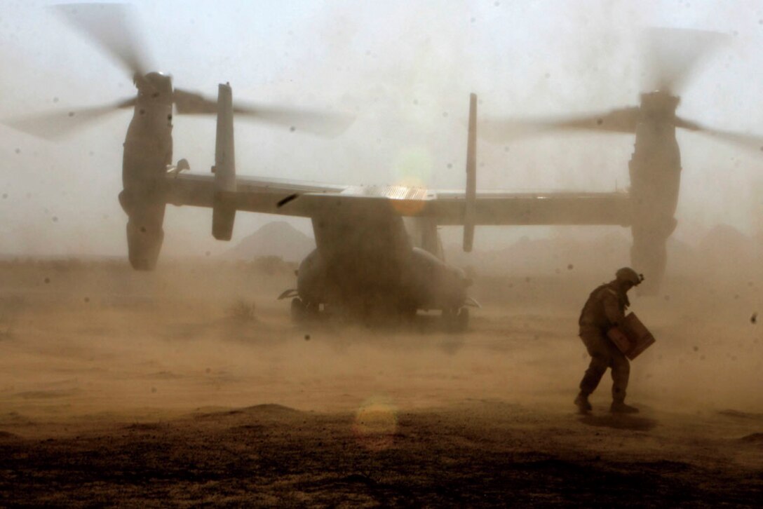 Lance Cpl. Ryan Loving, a heavy equipment operator, Motor Transport Company B, Combat Logistics Battalion 3, 1st Marine Logistics Group (Forward), offloads supplies from an Osprey to Marines of 1st Light Armored Reconnaissance Battalion at a forward landing support area in support of Operation Steel Dawn, Oct. 29. The LSA was used to resupply and refuel 1st LAR during the operation.