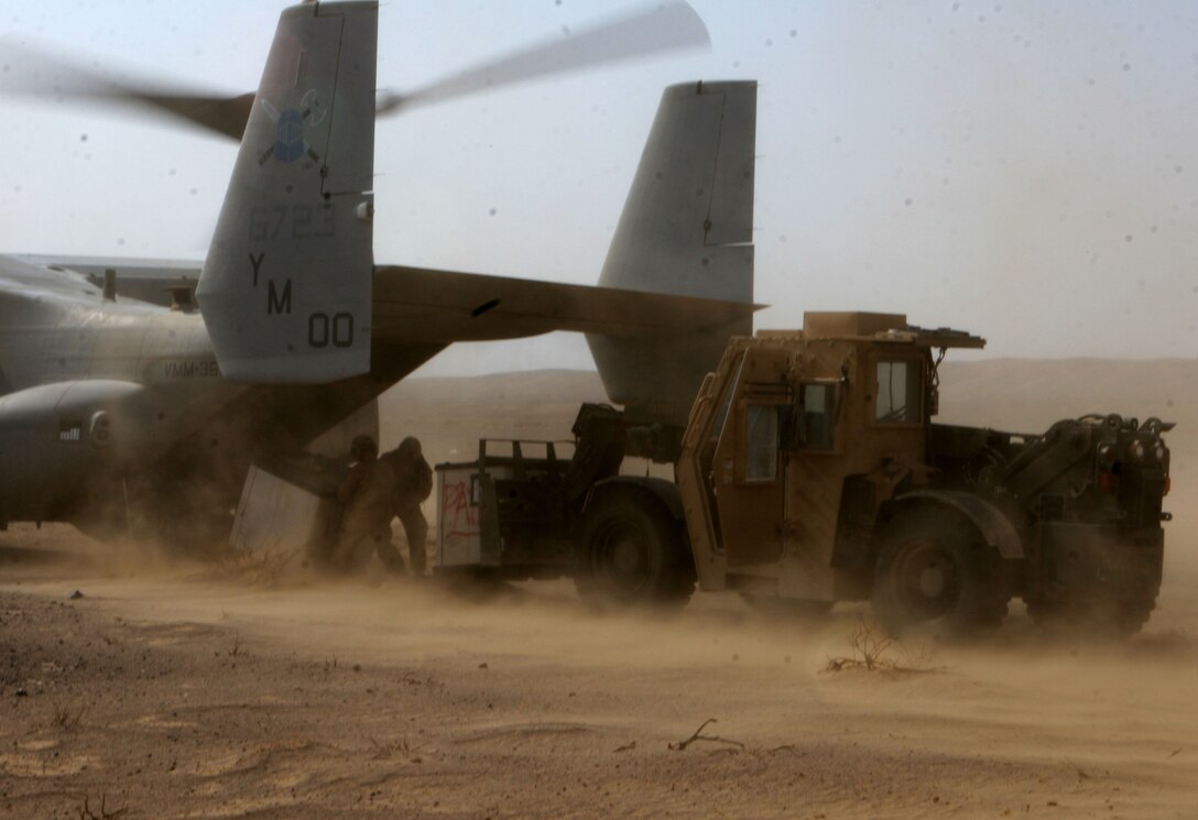 Lance Cpl. Ryan Loving, a heavy equipment operator, Motor Transport Company B, Combat Logistics Battalion 3, 1st Marine Logistics Group (Forward), offloads supplies from an Osprey to Marines of 1st Light Armored Reconnaissance Battalion at a forward landing support area in support of Operation Steel Dawn, Oct. 29. The operation involved a complete Marine Air Ground Task Force as well as Afghan and coalition forces.